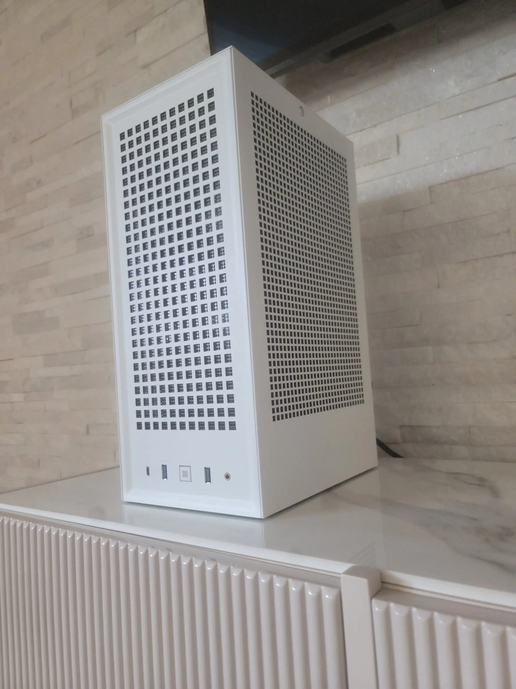 White Hyte Revolt 3 front corner with USB-C, dual USB-A, and the square power button