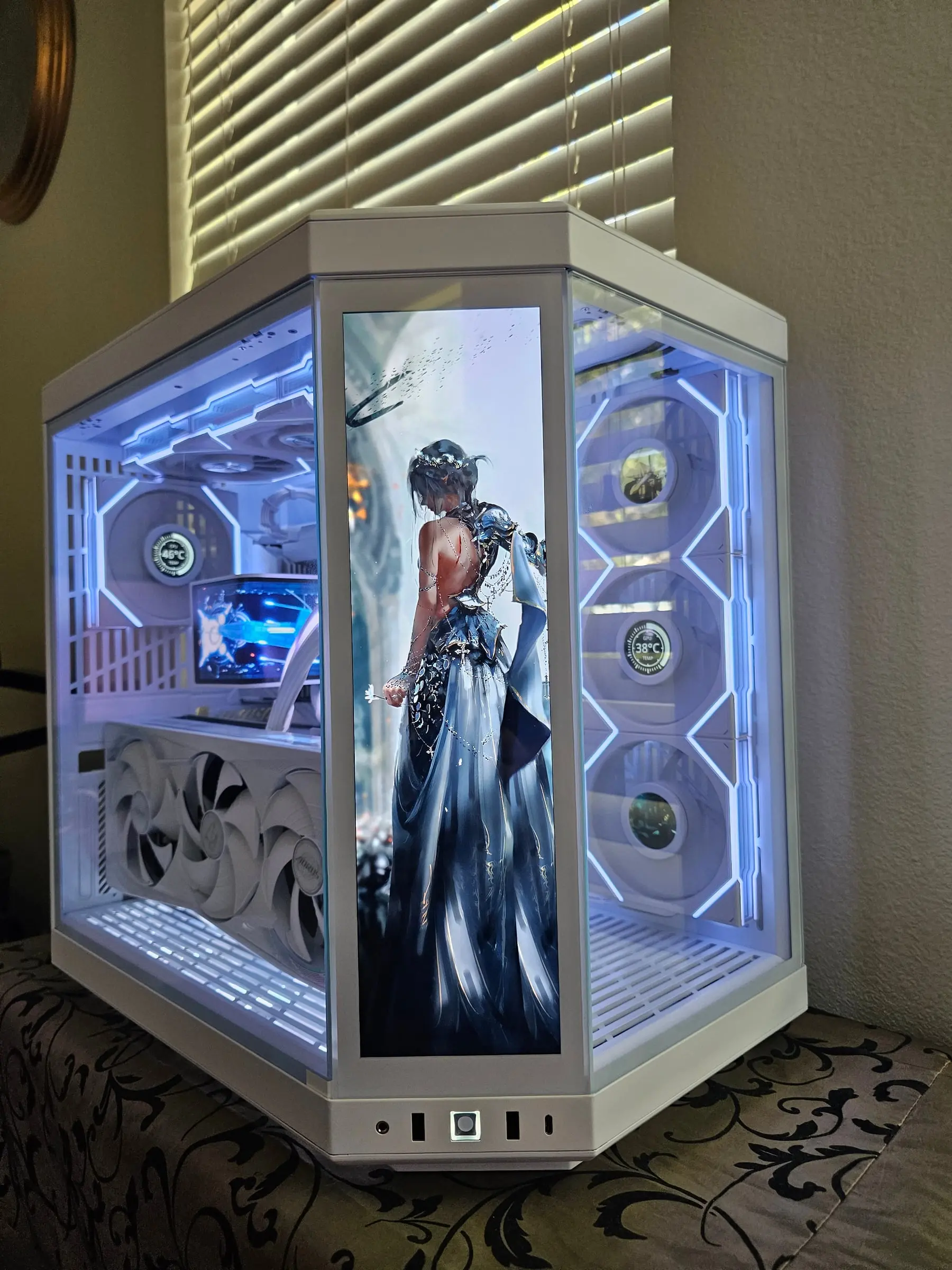 Y70 Touch in white — a silver-armored fantasy heroine on the front touchscreen, blue lighting throughout, AORUS RTX 5080 fans visible below