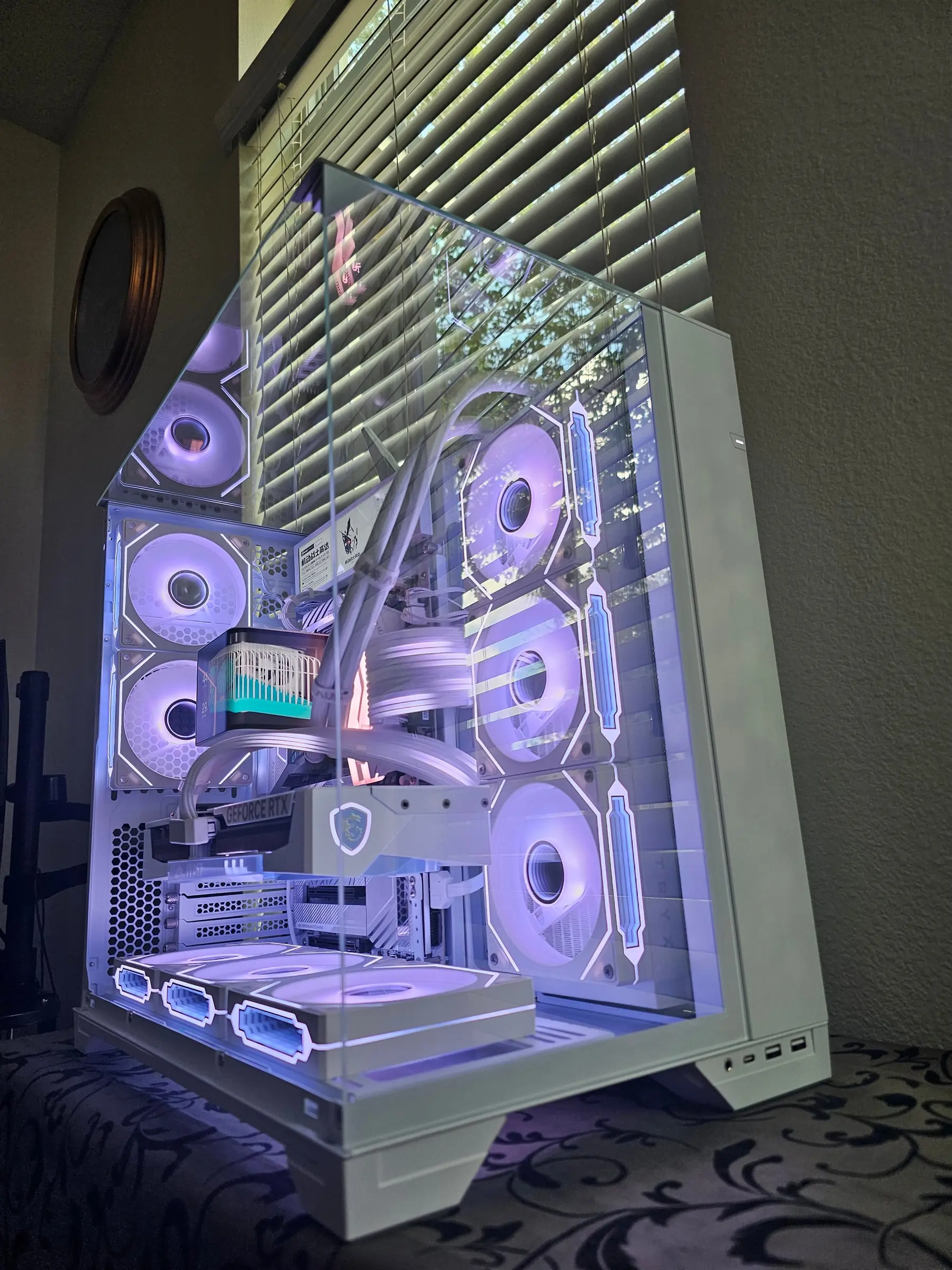 Violet-white three-quarter with the Frieren card, curved AMOLED, and sensor panel above the white MPG board