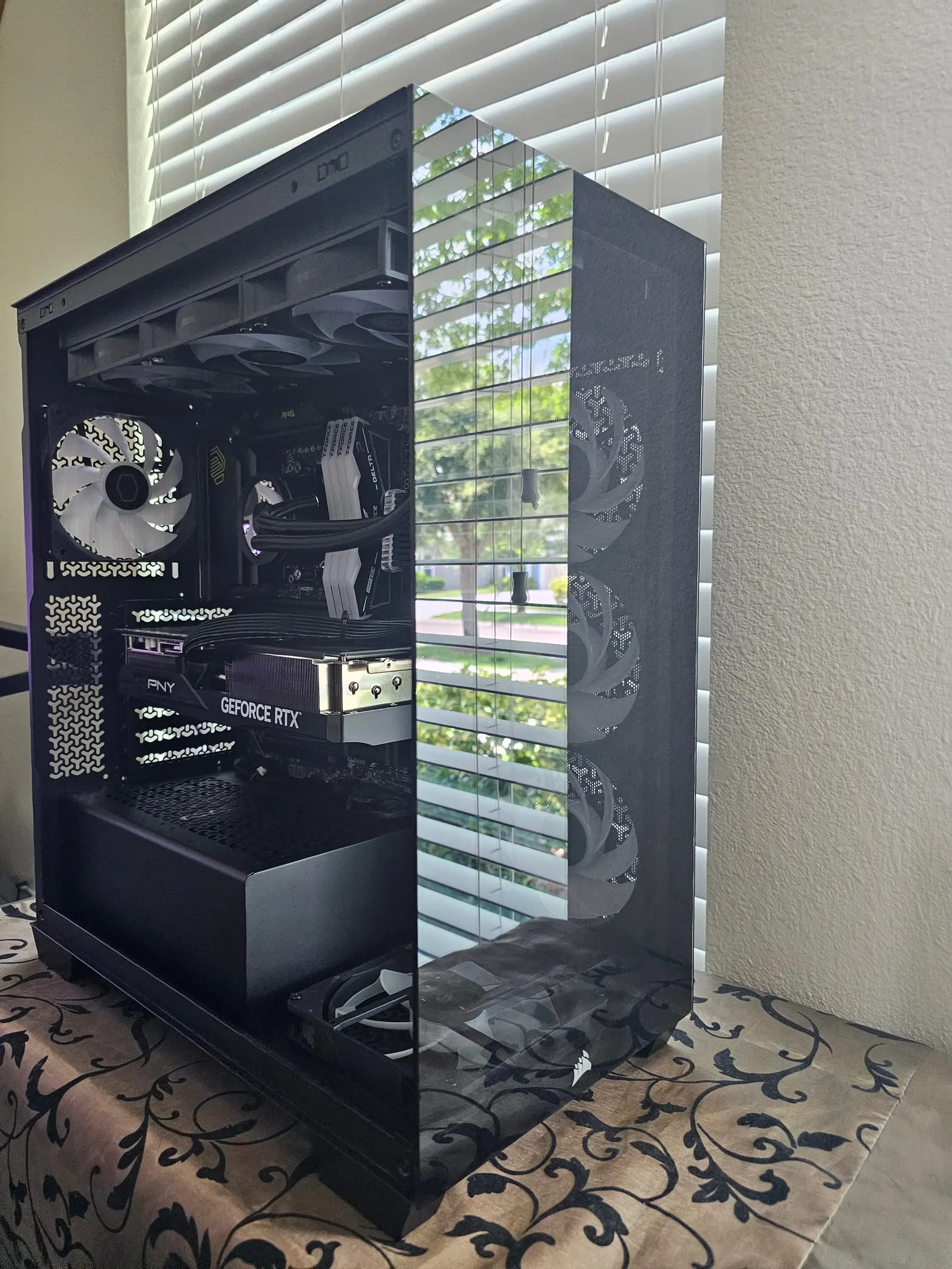 All-black 3500X unpowered in daylight — white T-Force Delta sticks and the PNY GeForce RTX card visible