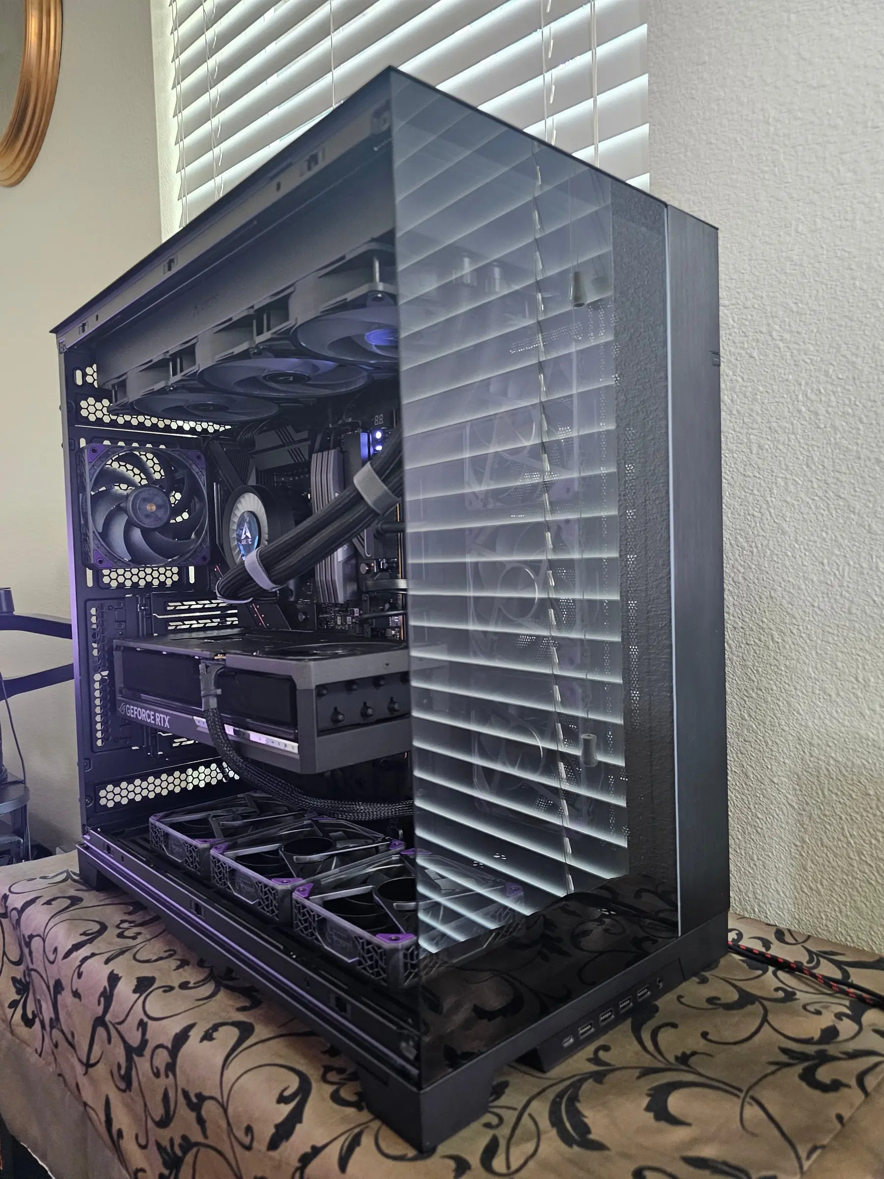 Unpowered daylight view — Arctic pump, Astral 5090 with support bracket, and Super Flower fan walls in the full tower