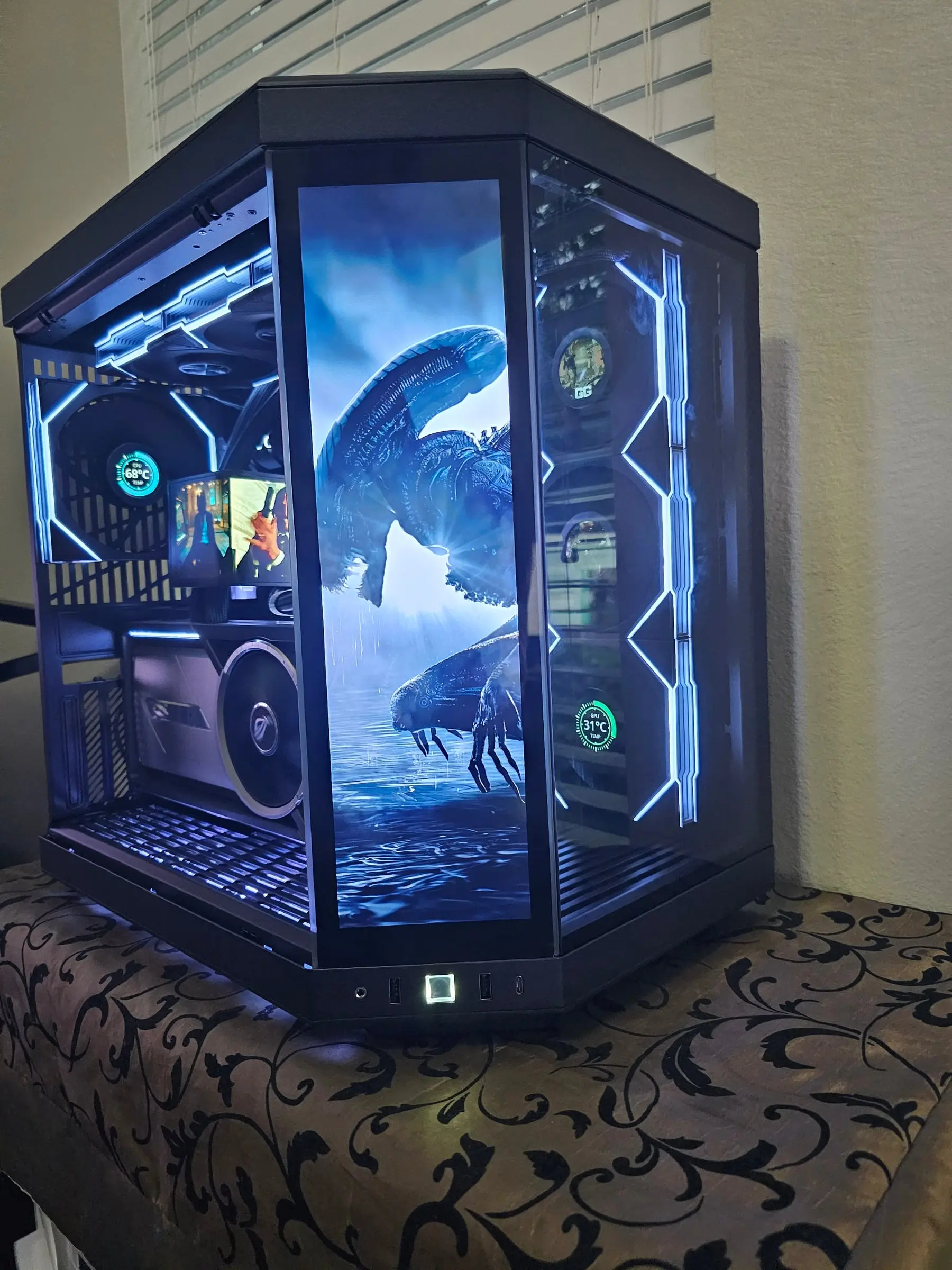 Y70 Touch in ice blue — kaiju art on the front screen, TRYX AMOLED playing a clip, fan LCDs reading CPU and GPU temps