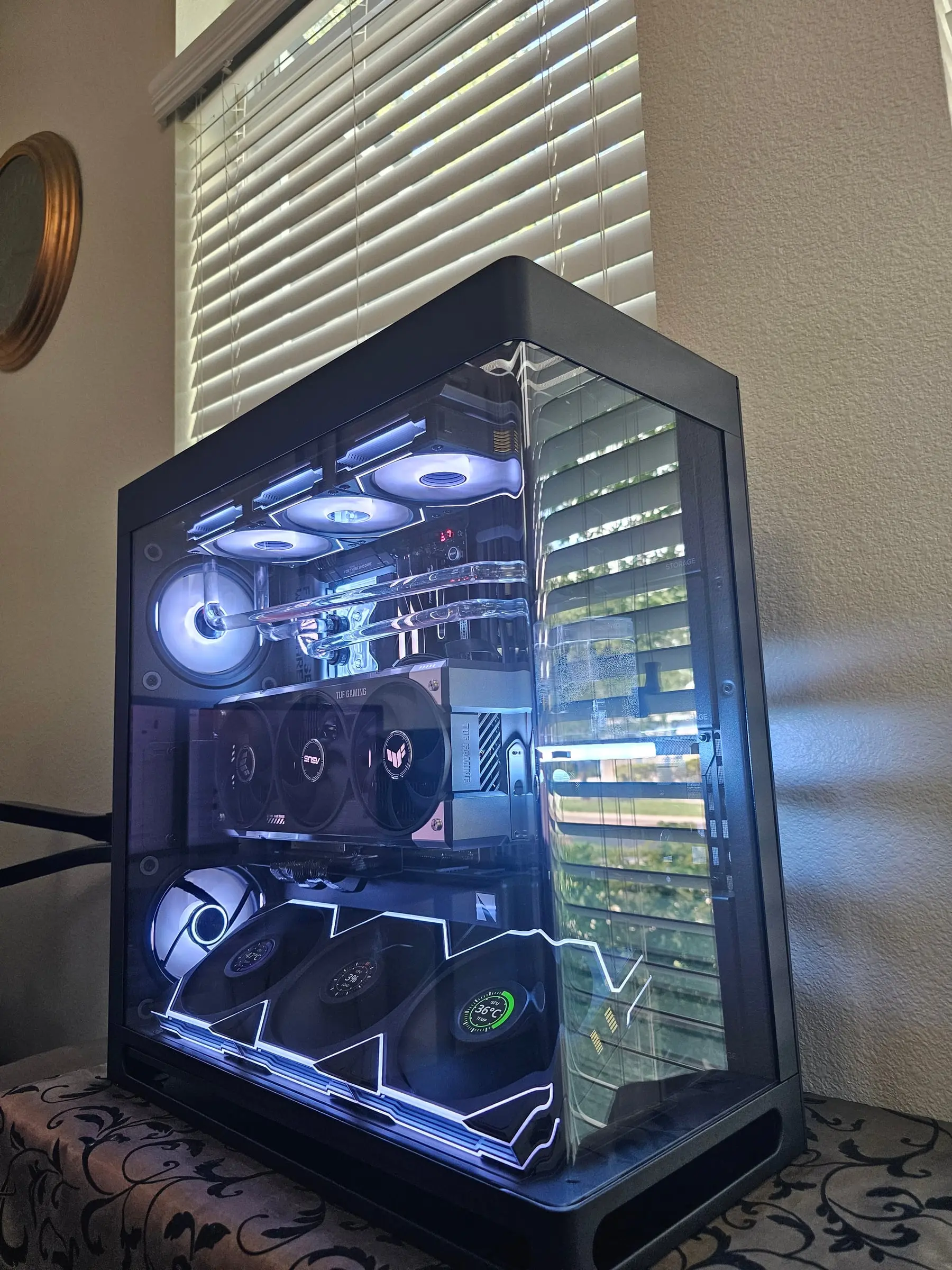 White theme angled view — hand-bent acrylic over the TUF 5080 with fan LCDs reading CPU and GPU