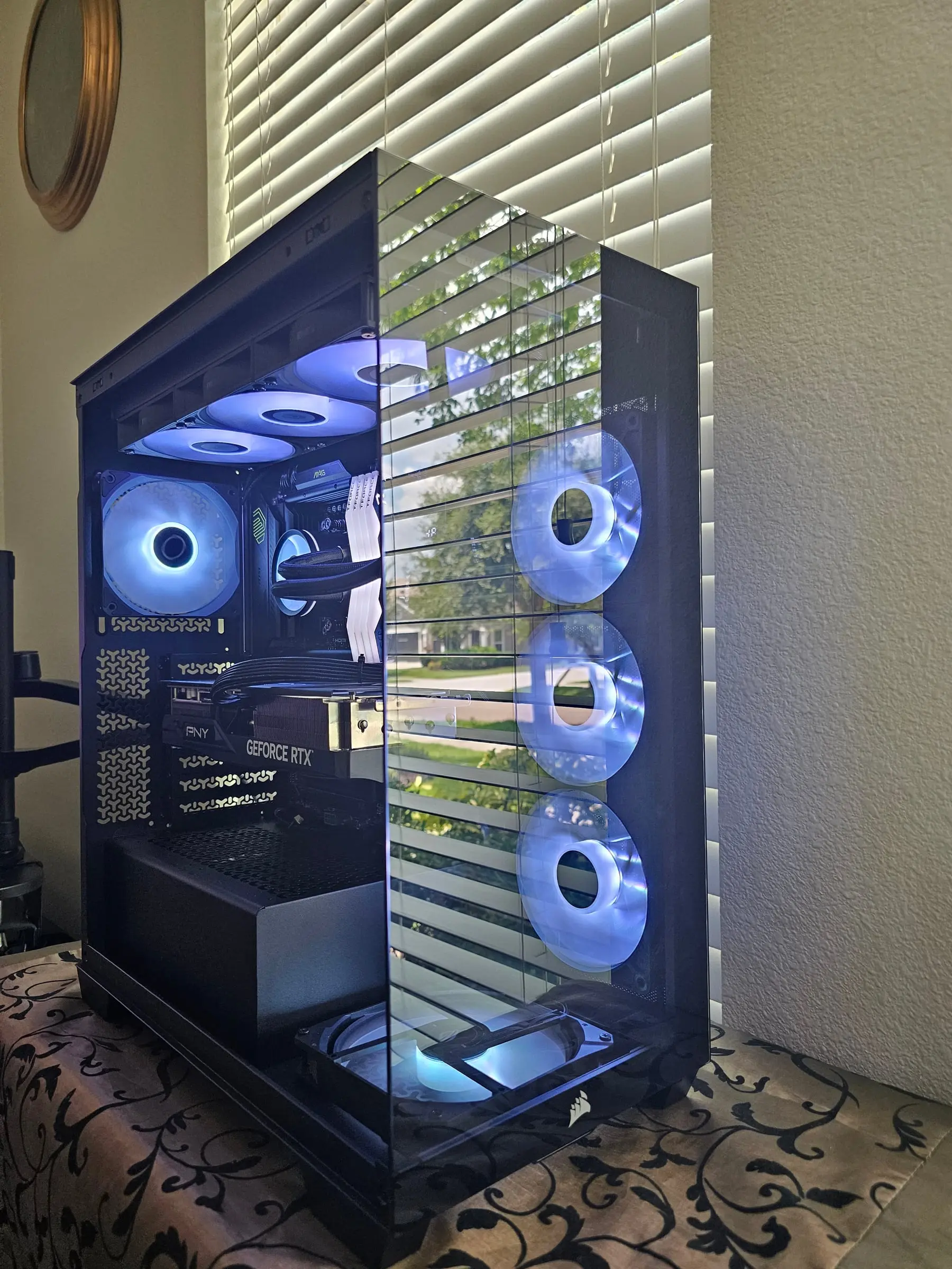 Ice-blue theme through the pillarless glass corner with the Corsair sails on the base