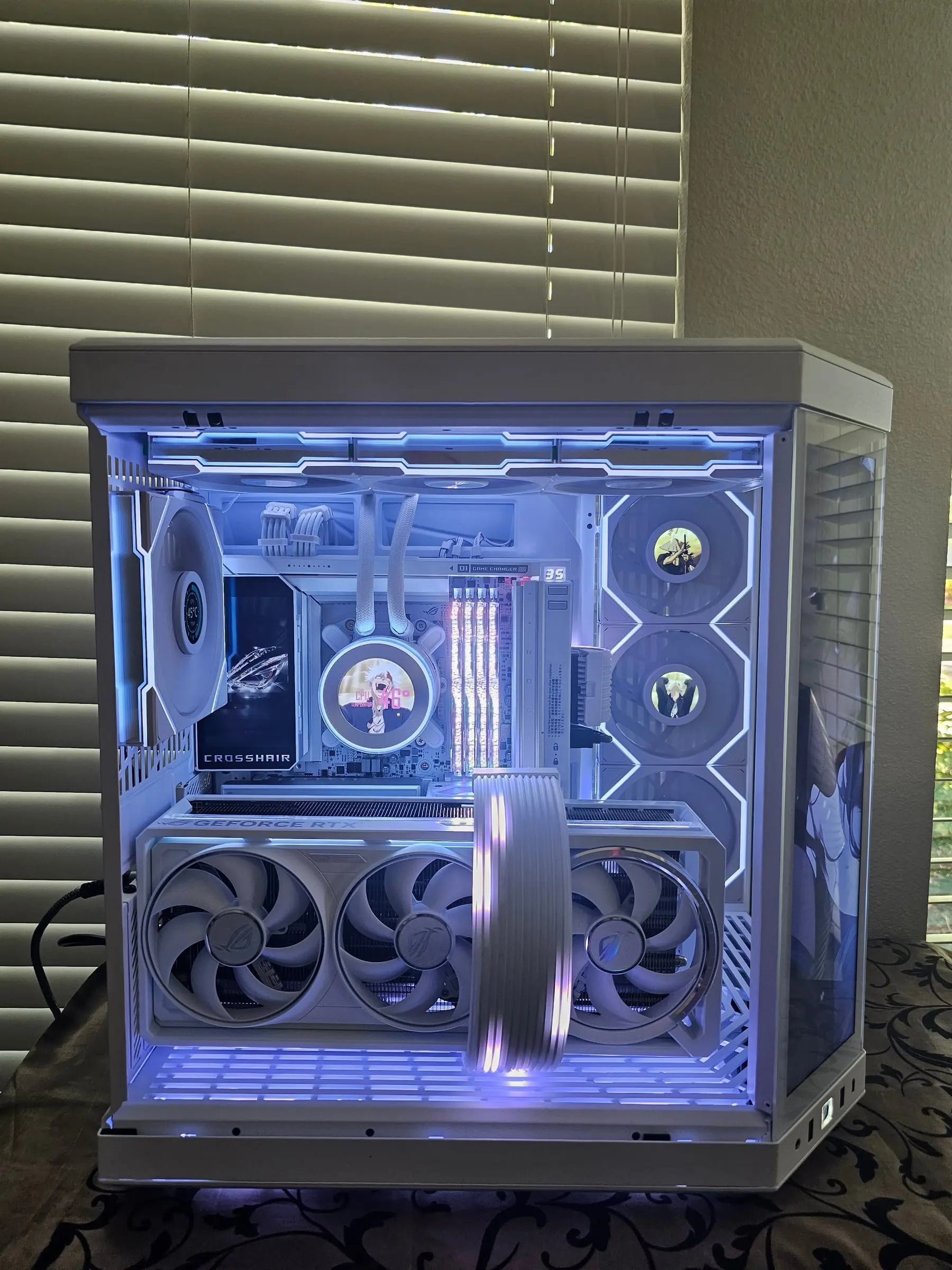 Front view powered in ice blue — Galahad II LCD pump readout, RGB Royal Neo RAM, and glowing Strimer GPU cable