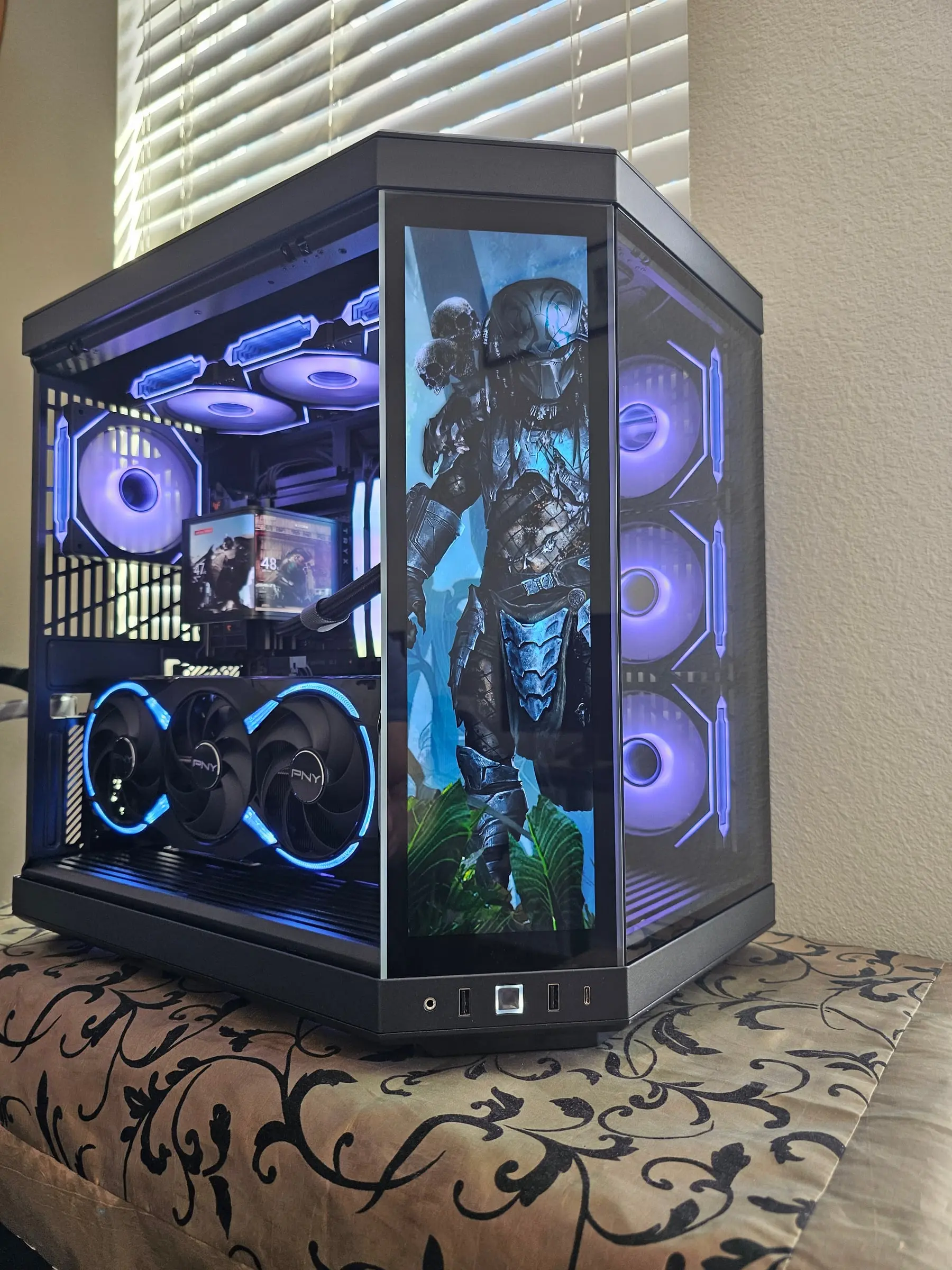 Predator with skulls on the front display, violet fans behind the panoramic glass