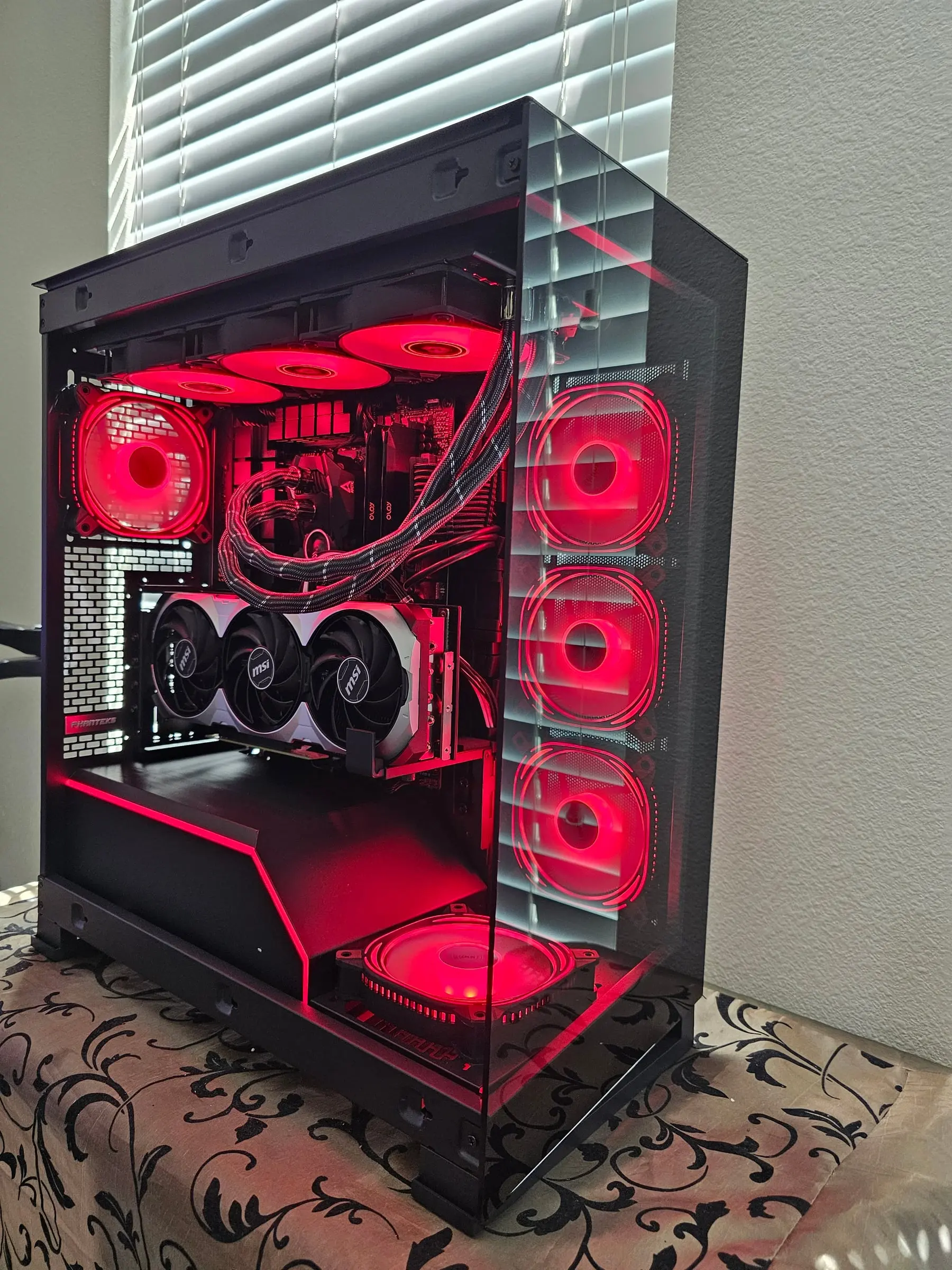Deep red theme across all eight infinity-mirror fans and the braided AIO tubing