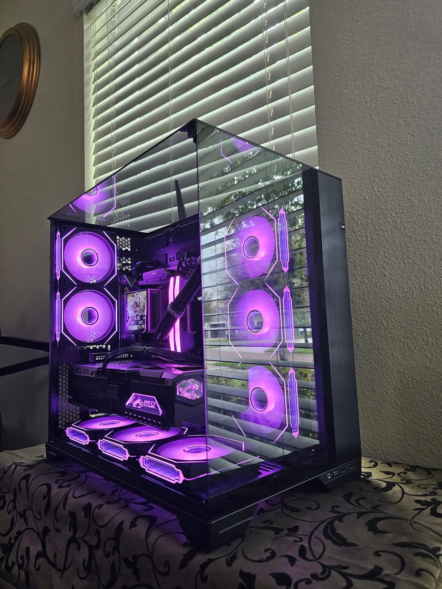 Purple theme filling the O11 Vision, RGB RAM and riser-mounted RTX 5090 Vanguard lit