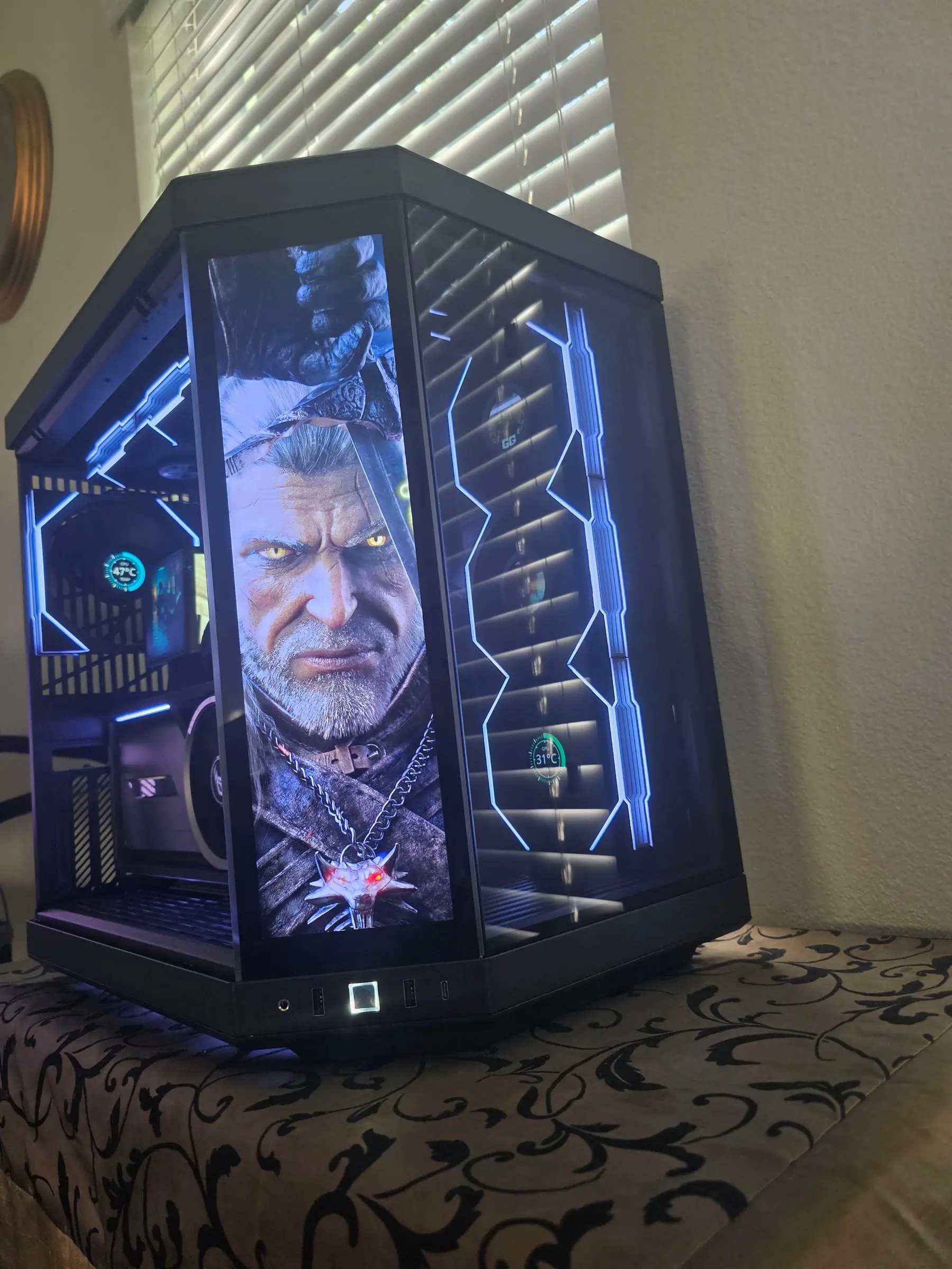 Witcher Geralt artwork across the front screen with the wolf medallion glowing