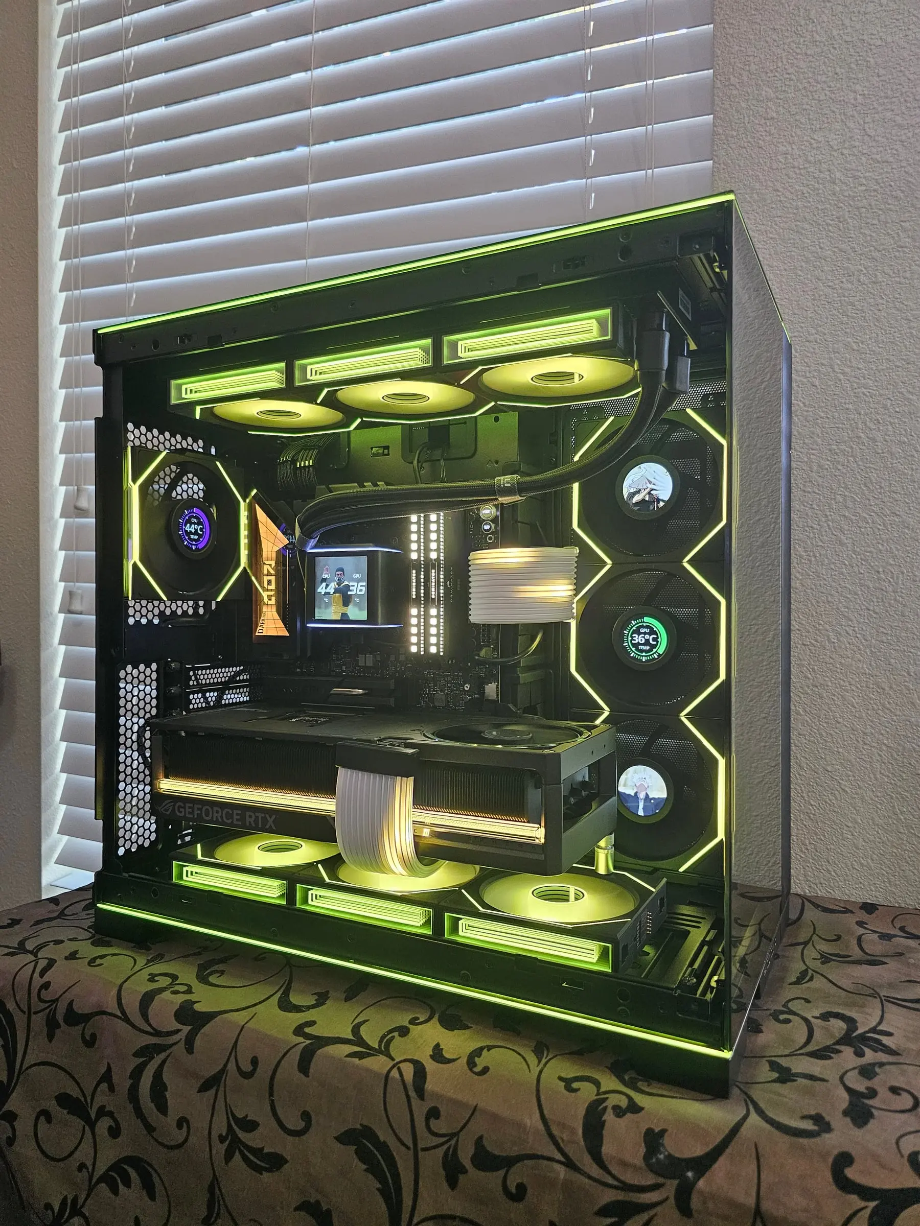 Lime theme straight-on — Dark Hero board, anime art on the fan LCDs, white Dominator kit glowing