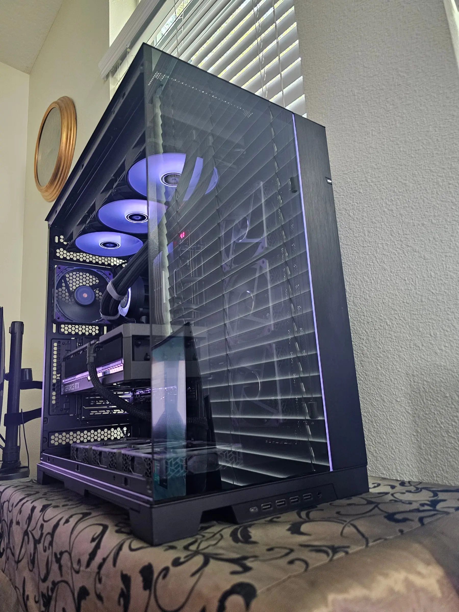 Violet three-quarter view through the tri-glass with the vertical light strip tracing the corner