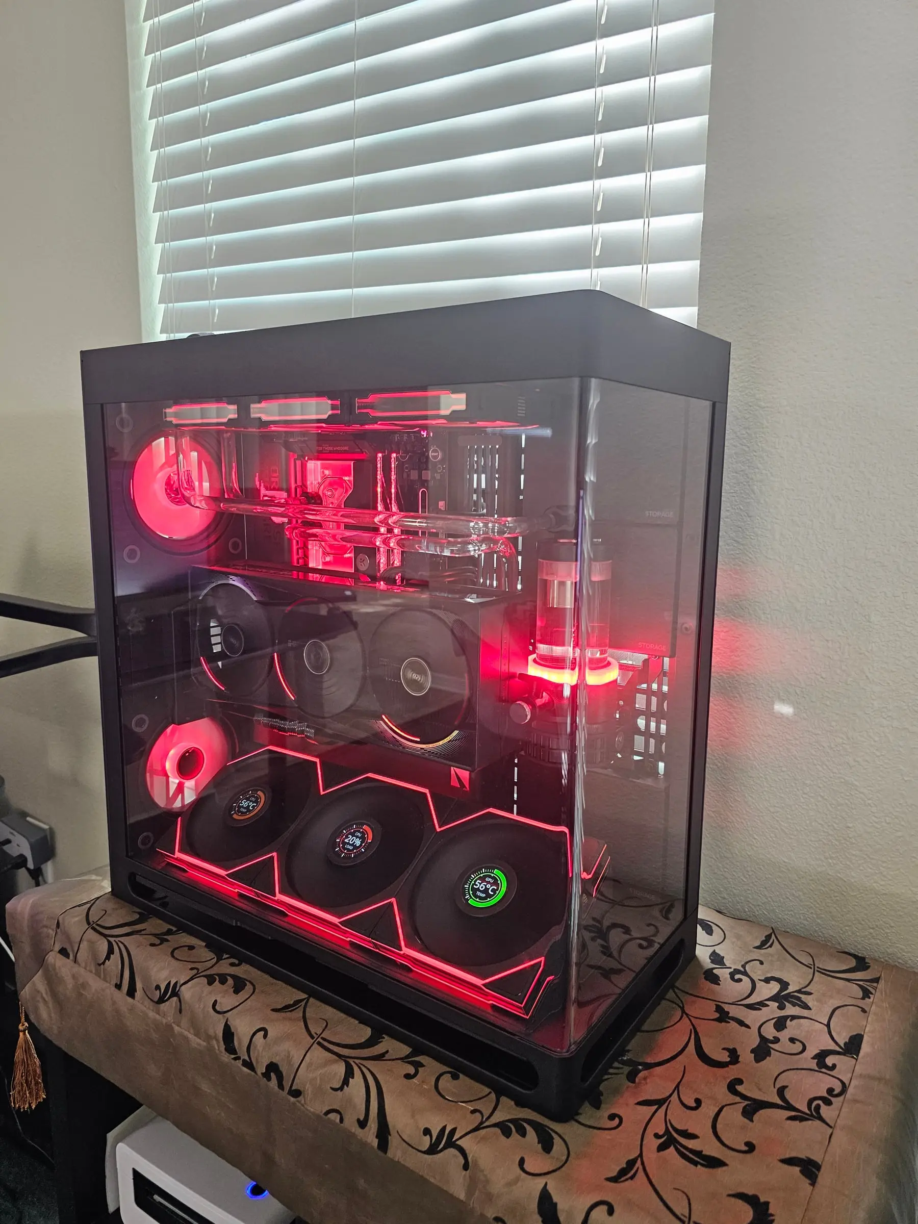 Red theme — coolant tower and EK block glowing crimson, zigzag fan wall lit to match
