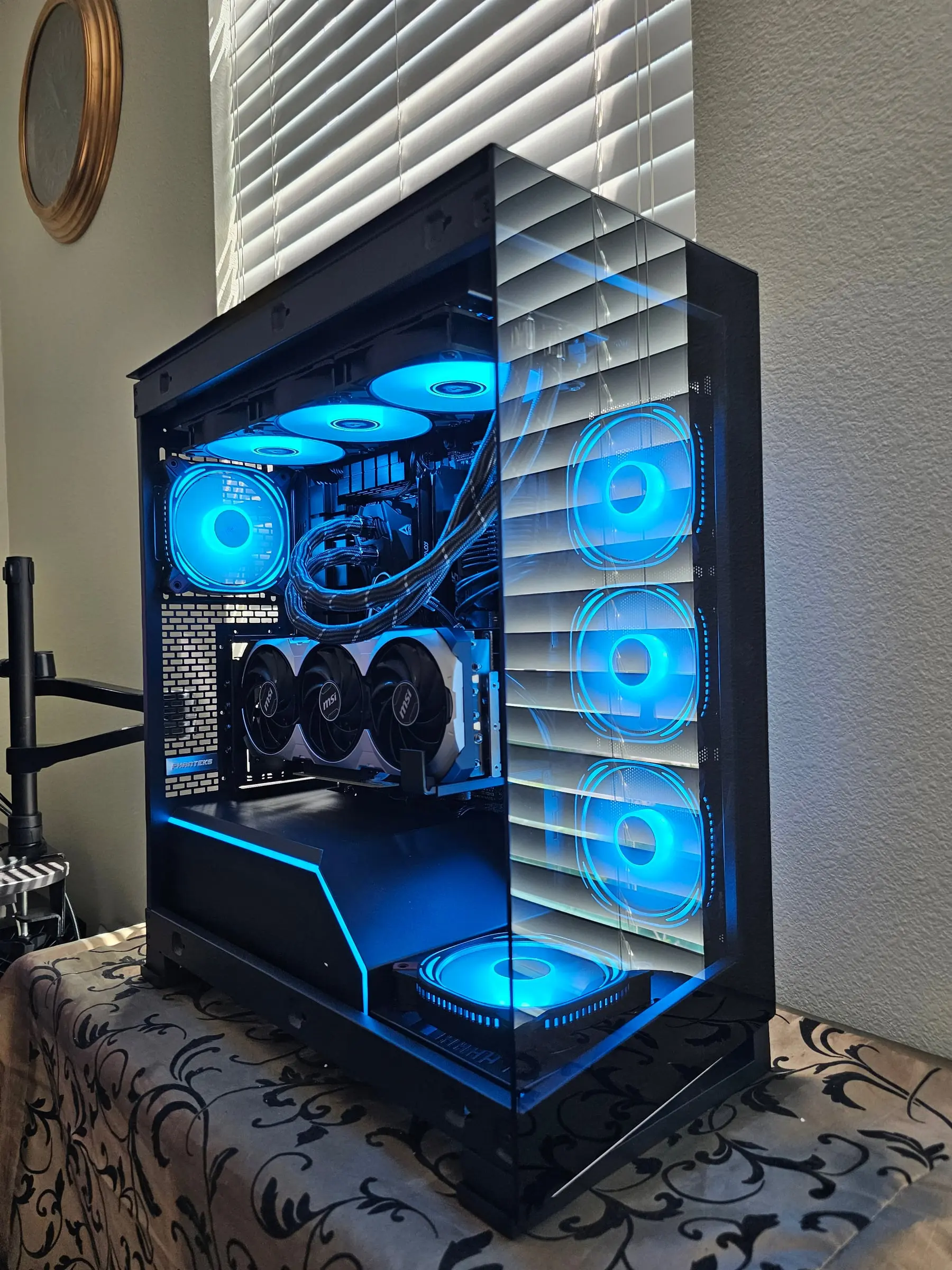 Electric blue theme with the triple-fan RTX 5070 Ti front and center