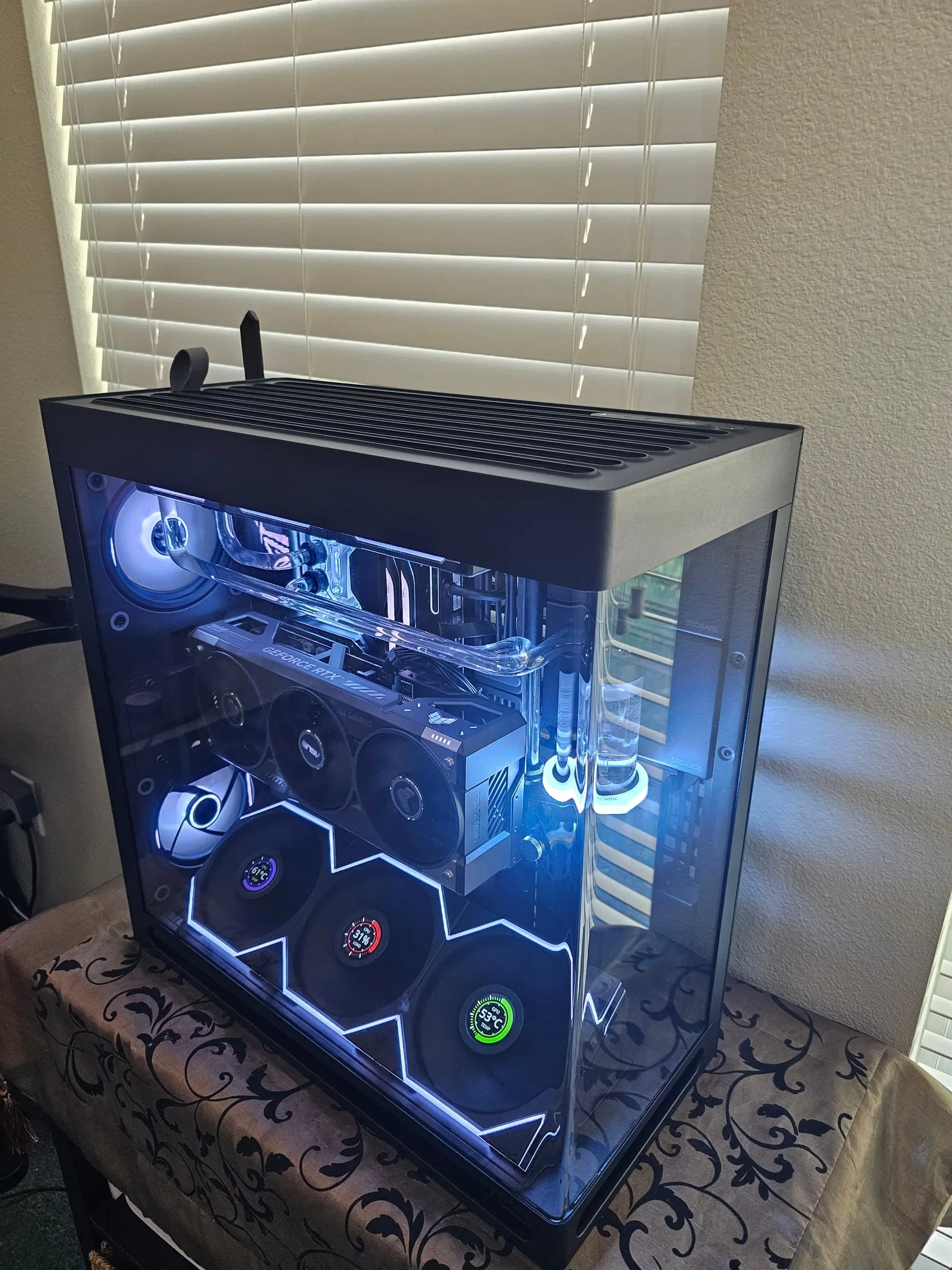 White theme with the GeForce RTX TUF badge visible and dials at idle temps