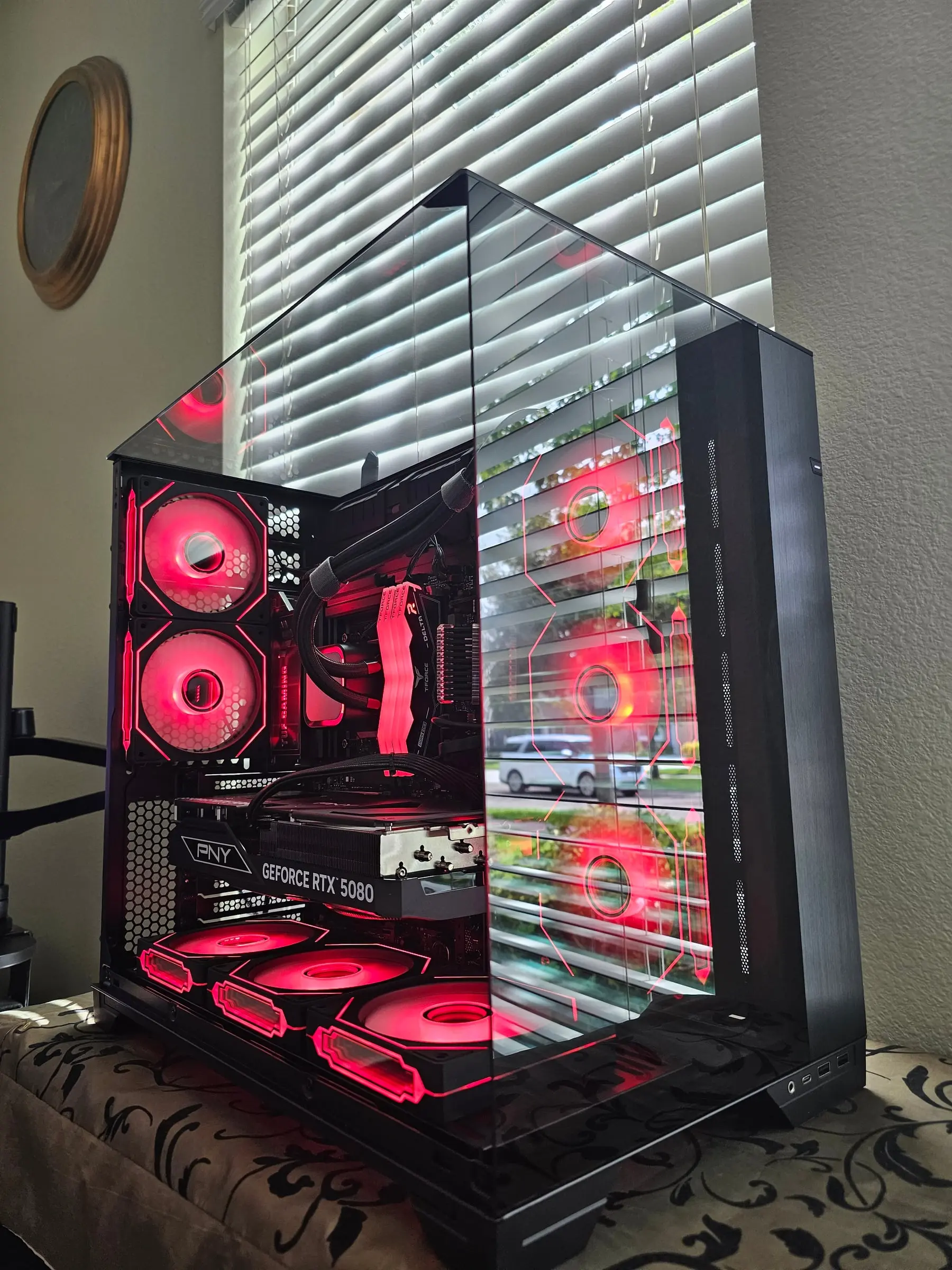 Red theme across the side fan wall, RAM, and bottom intake row
