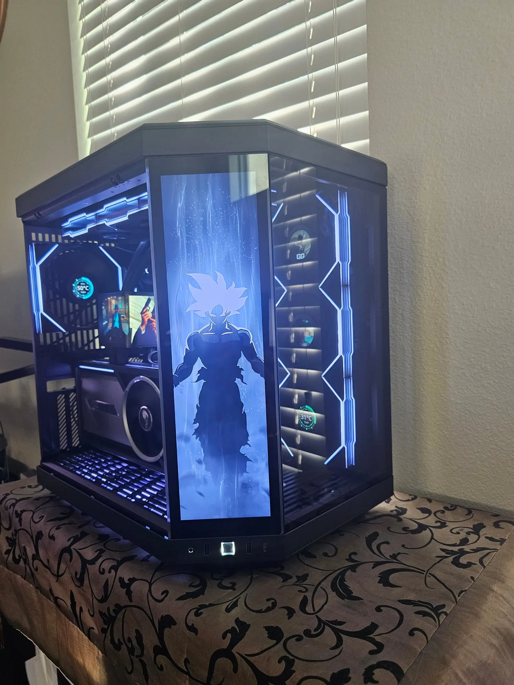 Ultra Instinct Goku silhouette in ice blue on the Y70 touchscreen