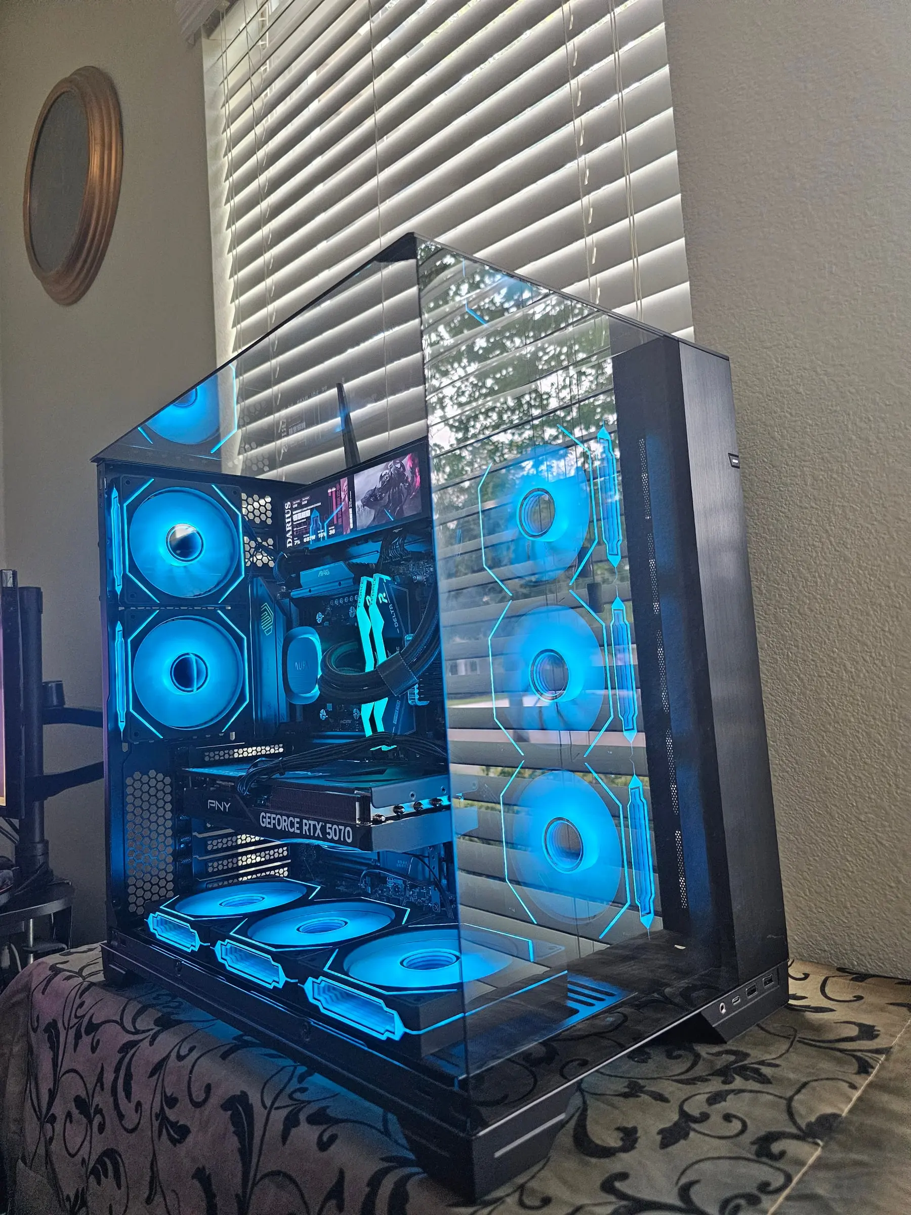Ice-blue theme filling the glass box, AURA pump cover lit to match