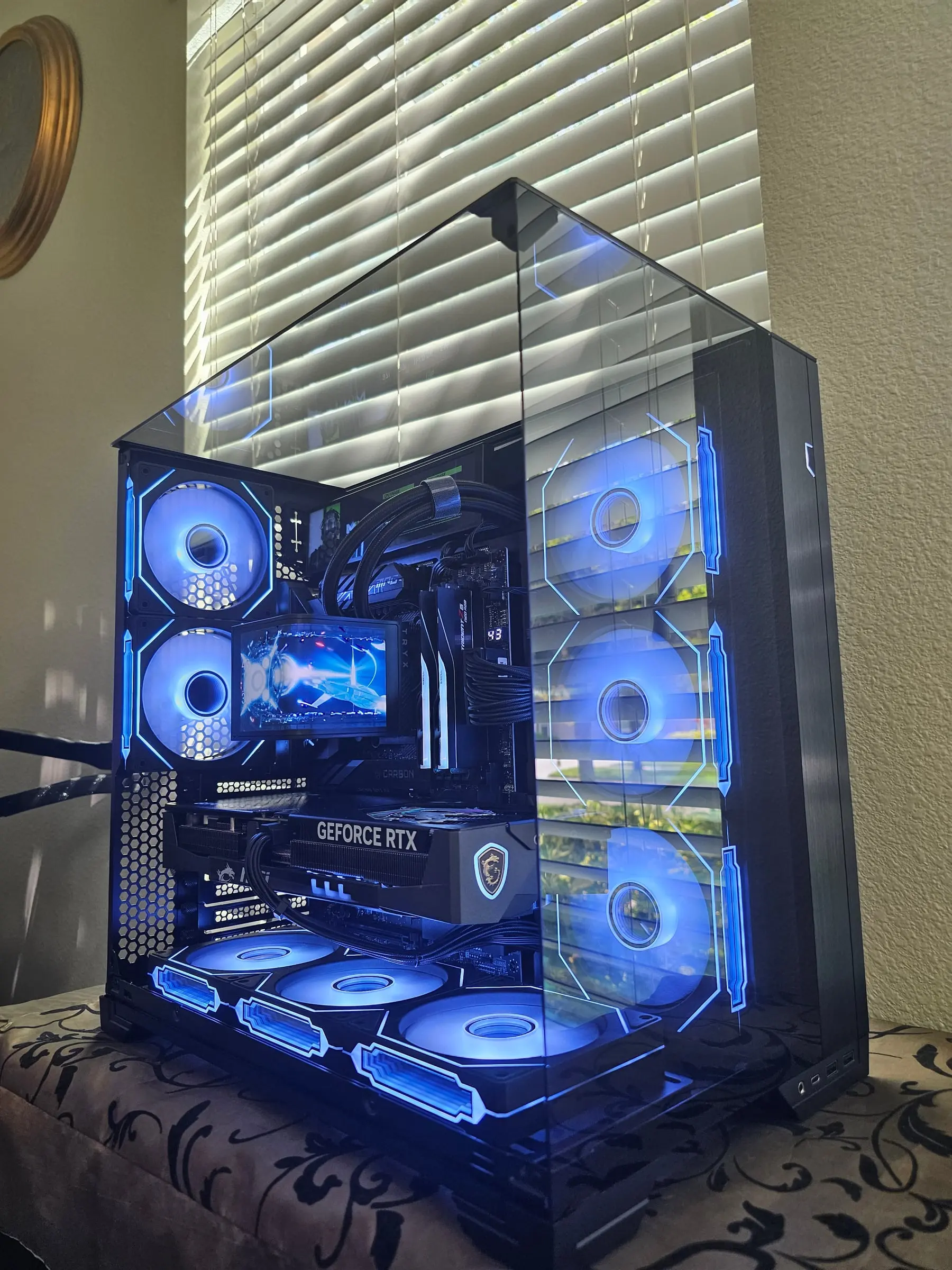 Blue theme — Trident Z5 Neo sticks and the debug readout beside the braided loop lines