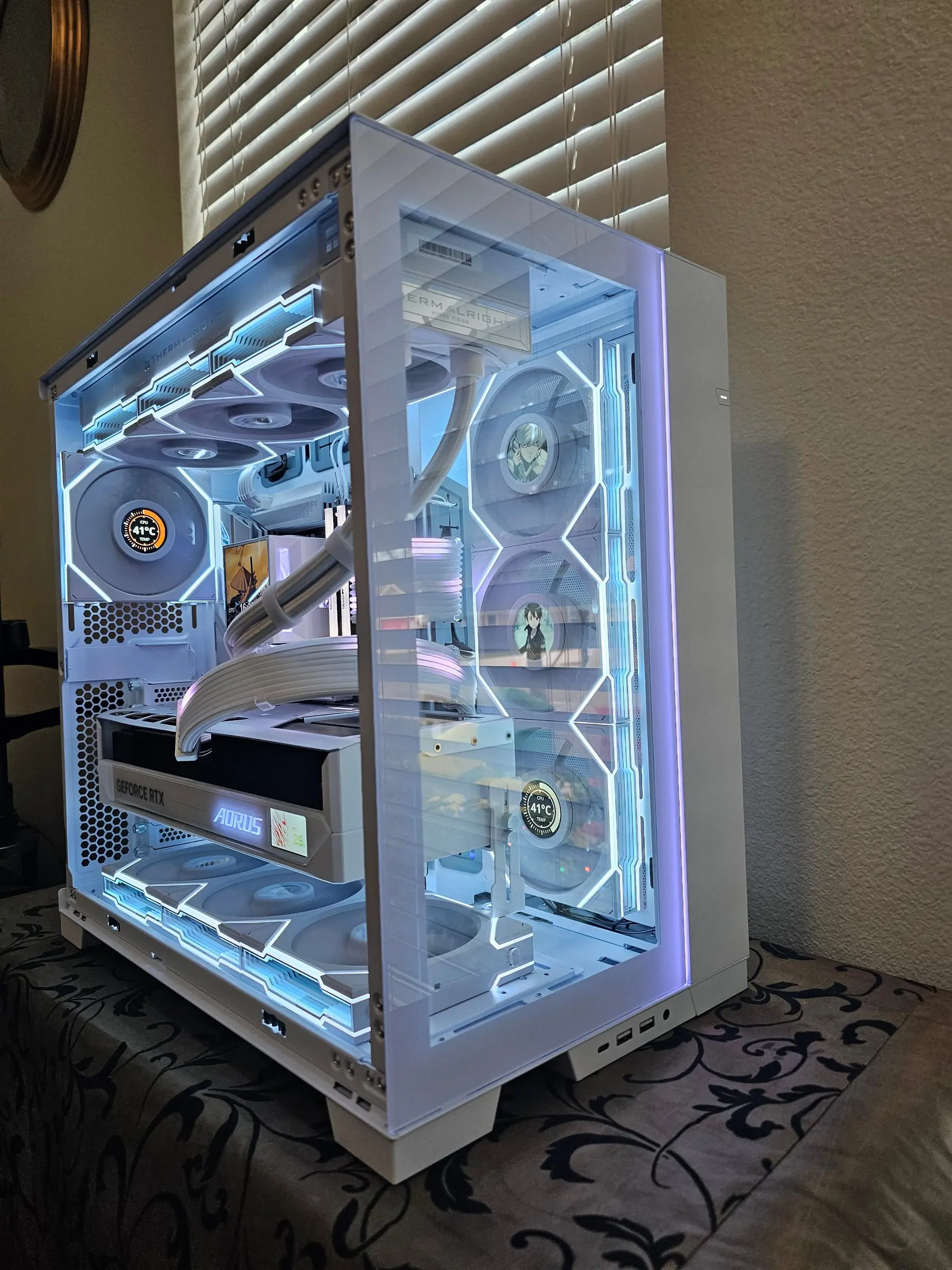 Full side profile — Death Note and SAO art on the fan LCDs, CPU dial reading 41°C, lavender edge glow