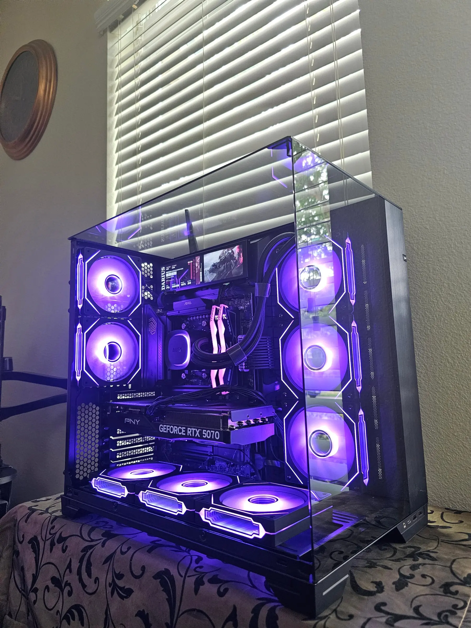Purple theme with the sensor panel showing game art above the GPU