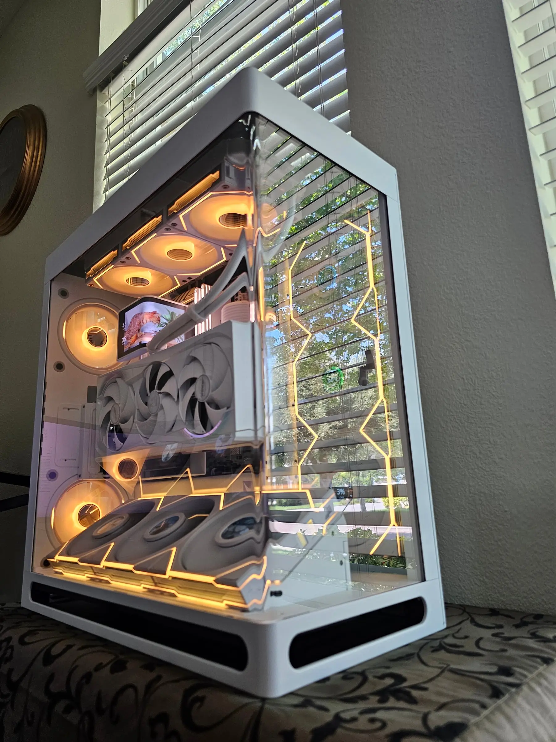 Warm amber theme tracing every fan frame through the curved glass