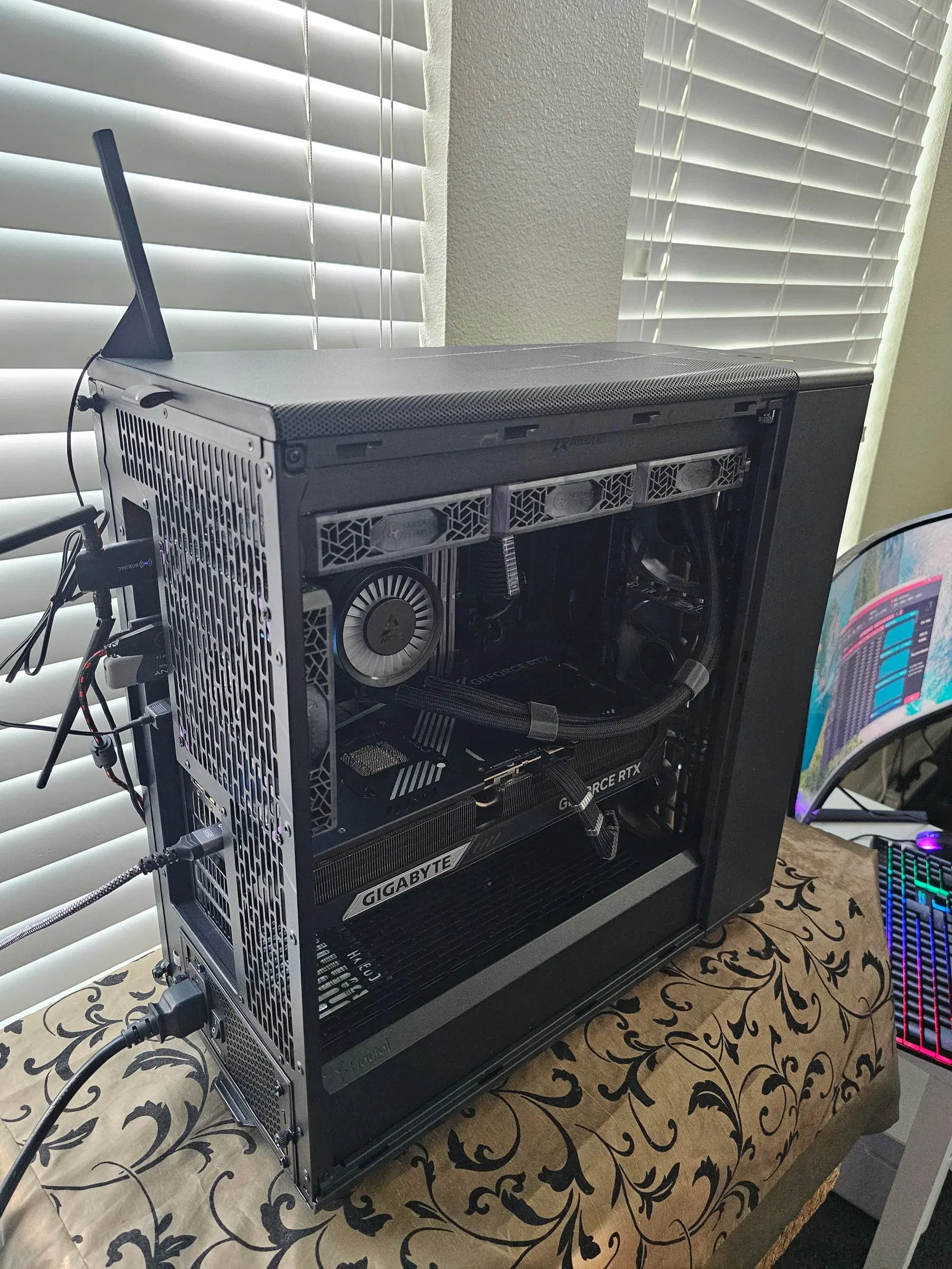 Interior from the rear quarter — Super Flower fans, Arctic pump, and the Gigabyte 5090