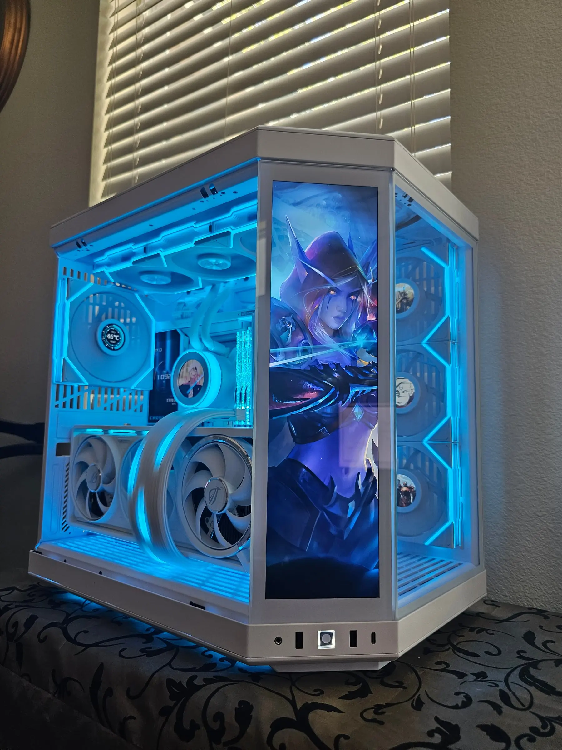 Cyan lighting theme with fantasy ranger art on the front display and matching fan screens