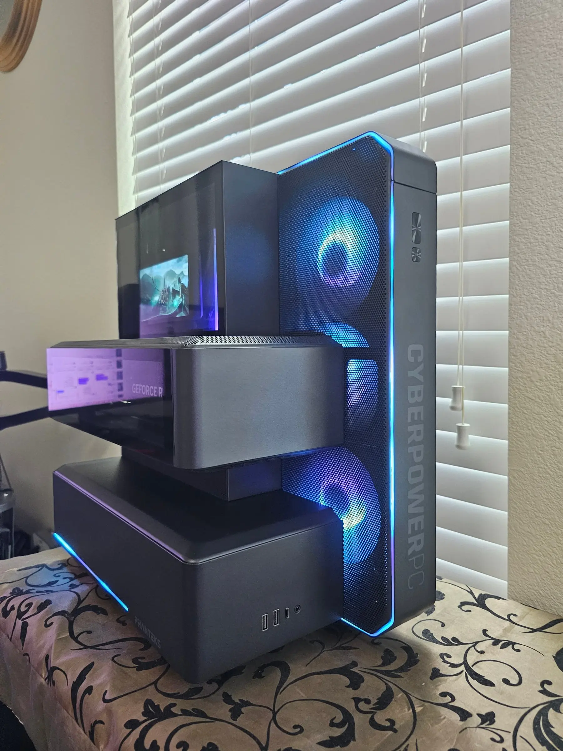 Ice-blue theme — fan tower rings lit, edge strips tracing the stacked chassis