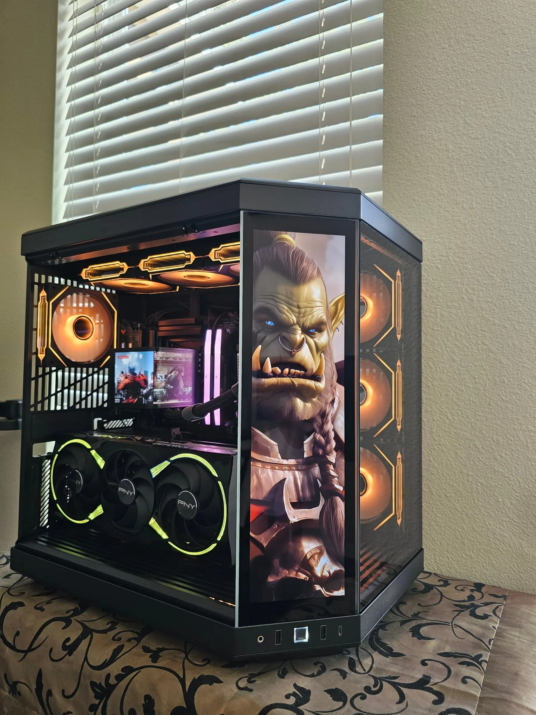 Amber theme with a World of Warcraft orc portrait filling the front display