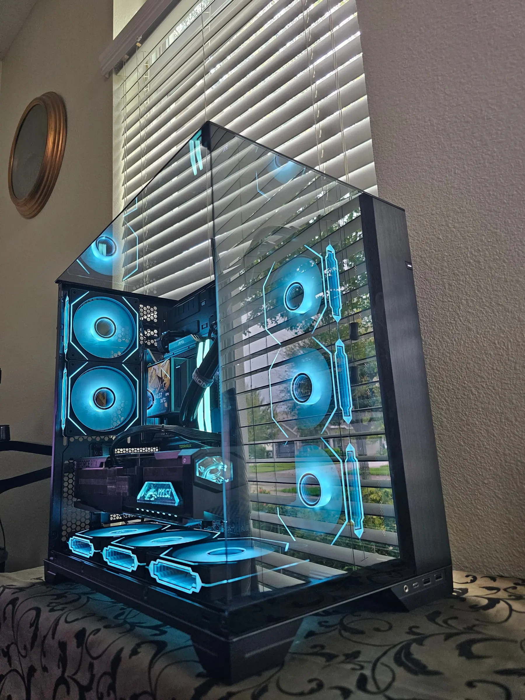 Cyan theme with the Hyper Vision pump LCD showing live CPU and GPU temperatures