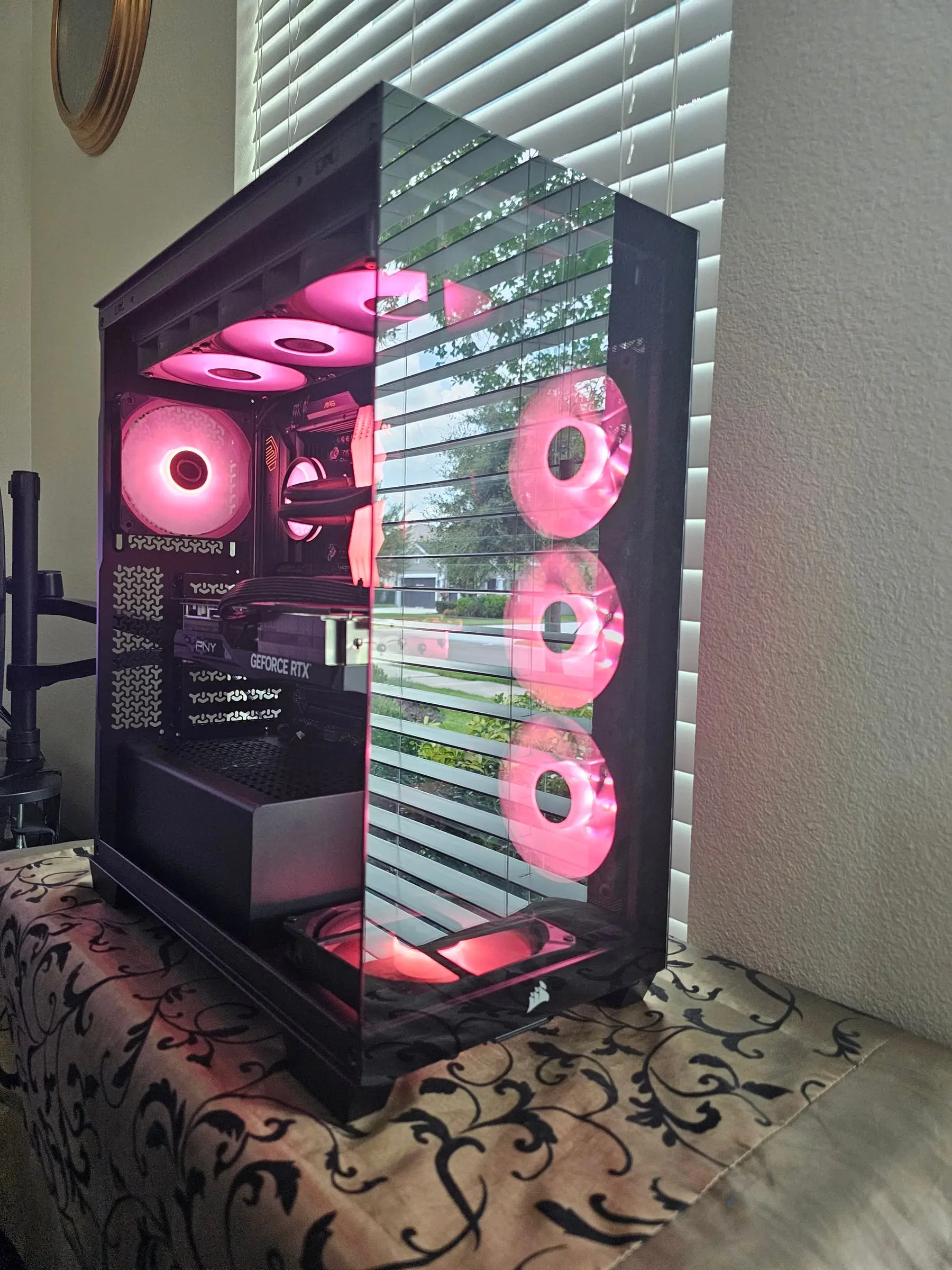 Low-angle cyan view of the tri-fan side wall and bottom intake glow