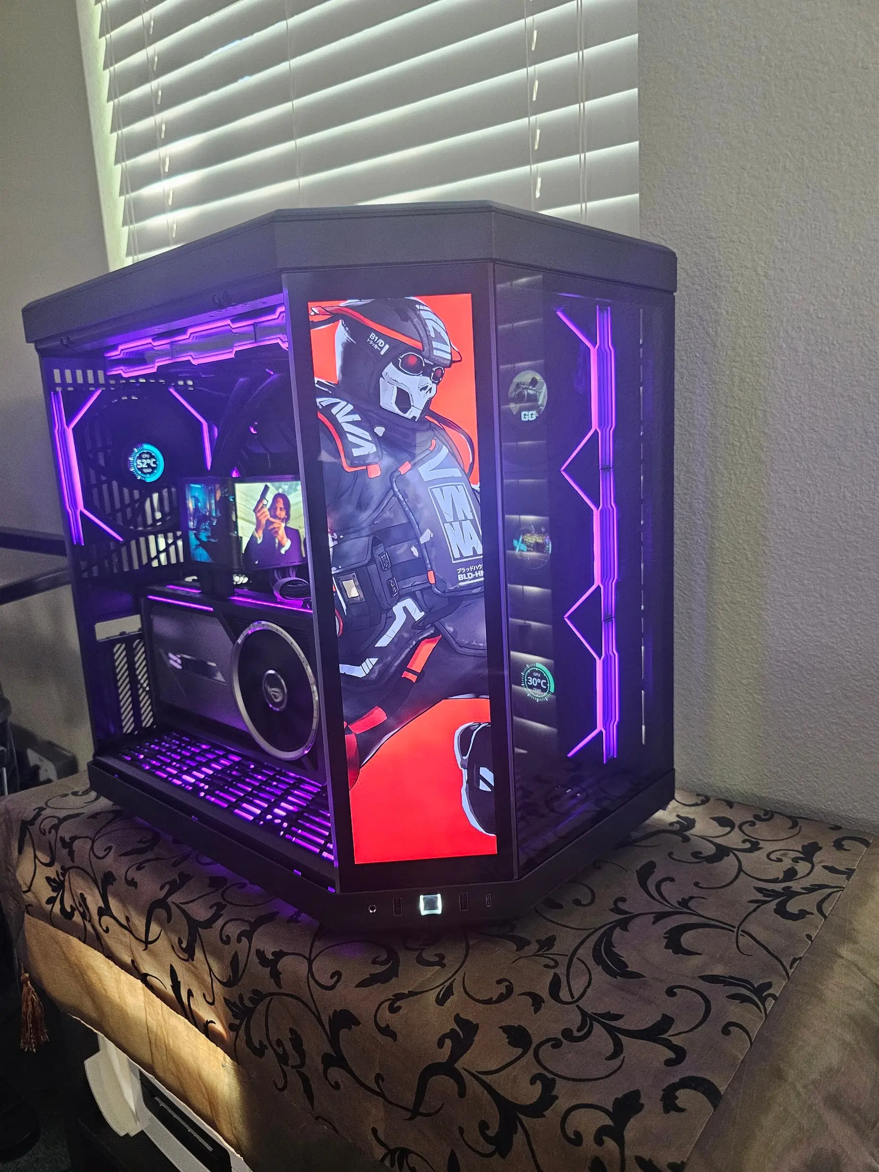 Purple theme with red masked-operator art on the front display