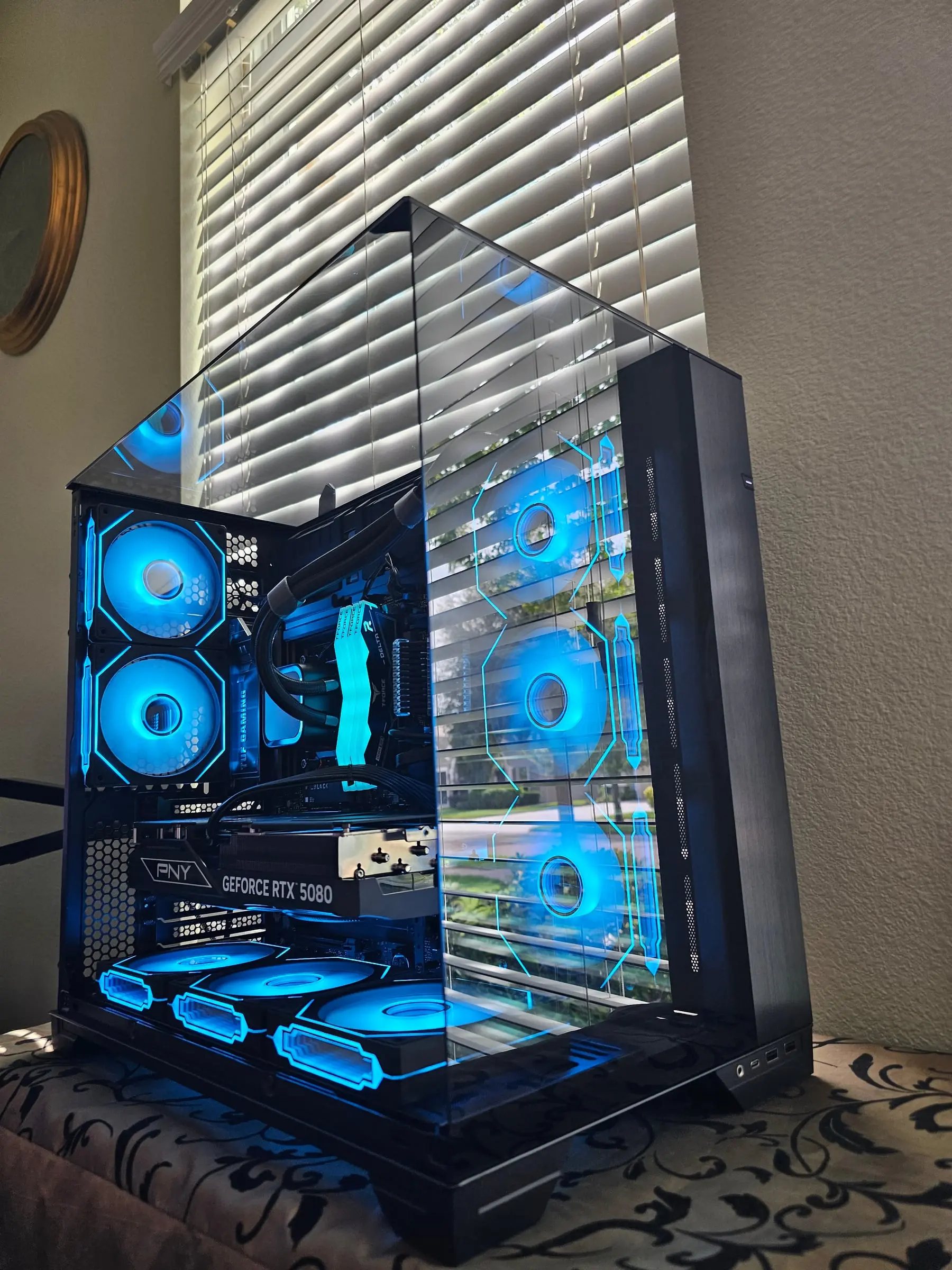 Deep blue theme — hex fan outlines and the GeForce RTX 5080 badge lit