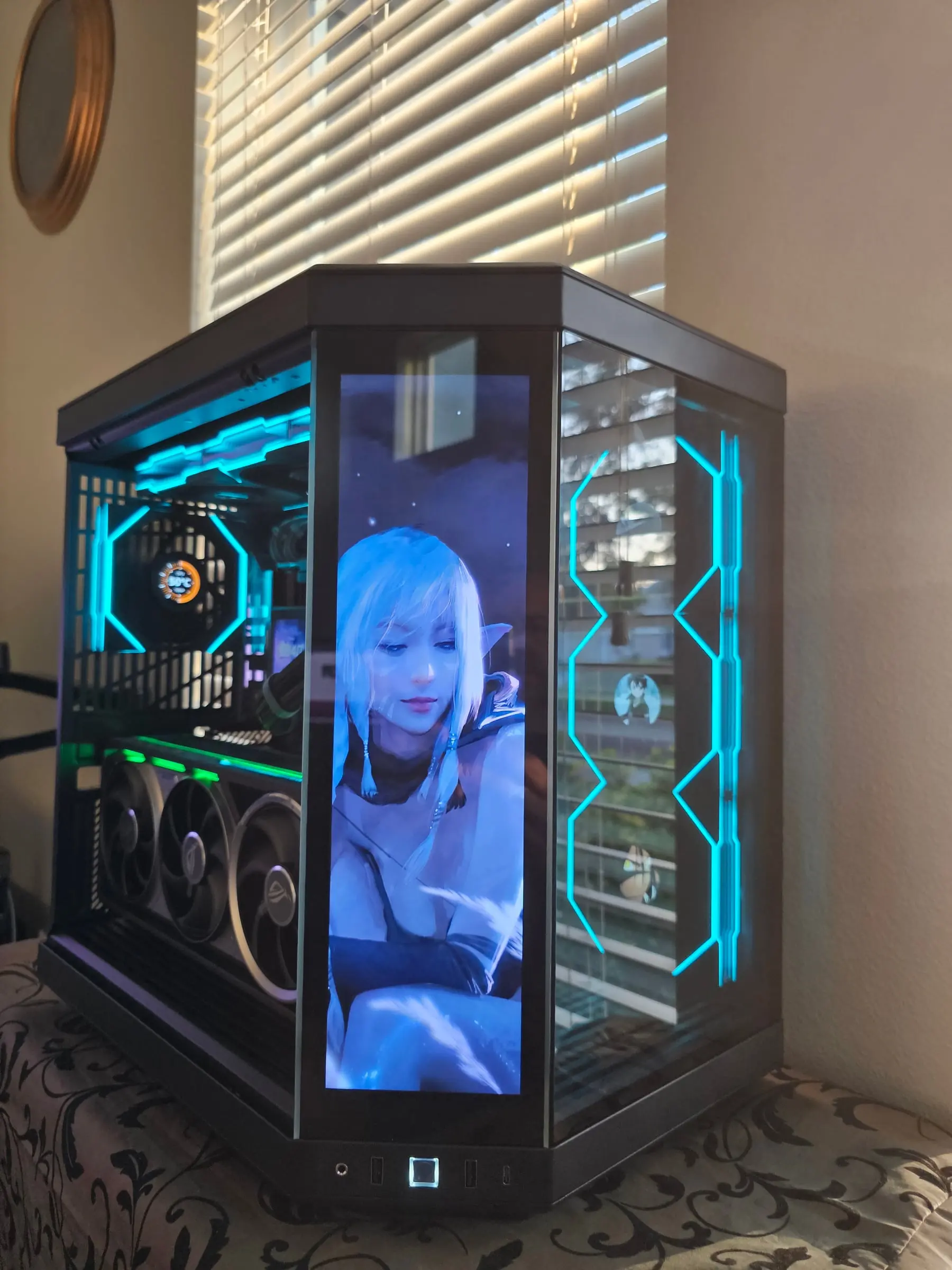 Teal theme with white-haired elf art on the front screen and hex-lit side fans
