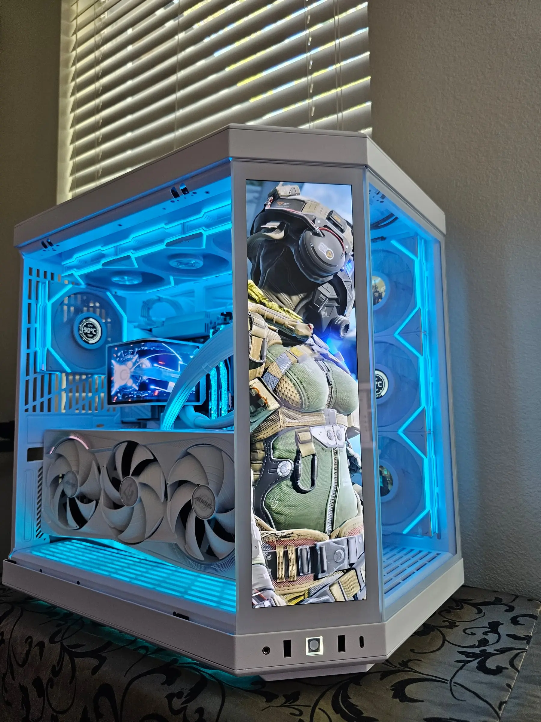 Cyan lighting with a tactical soldier character on the touchscreen, GPU running at 50°C under the AORUS shroud