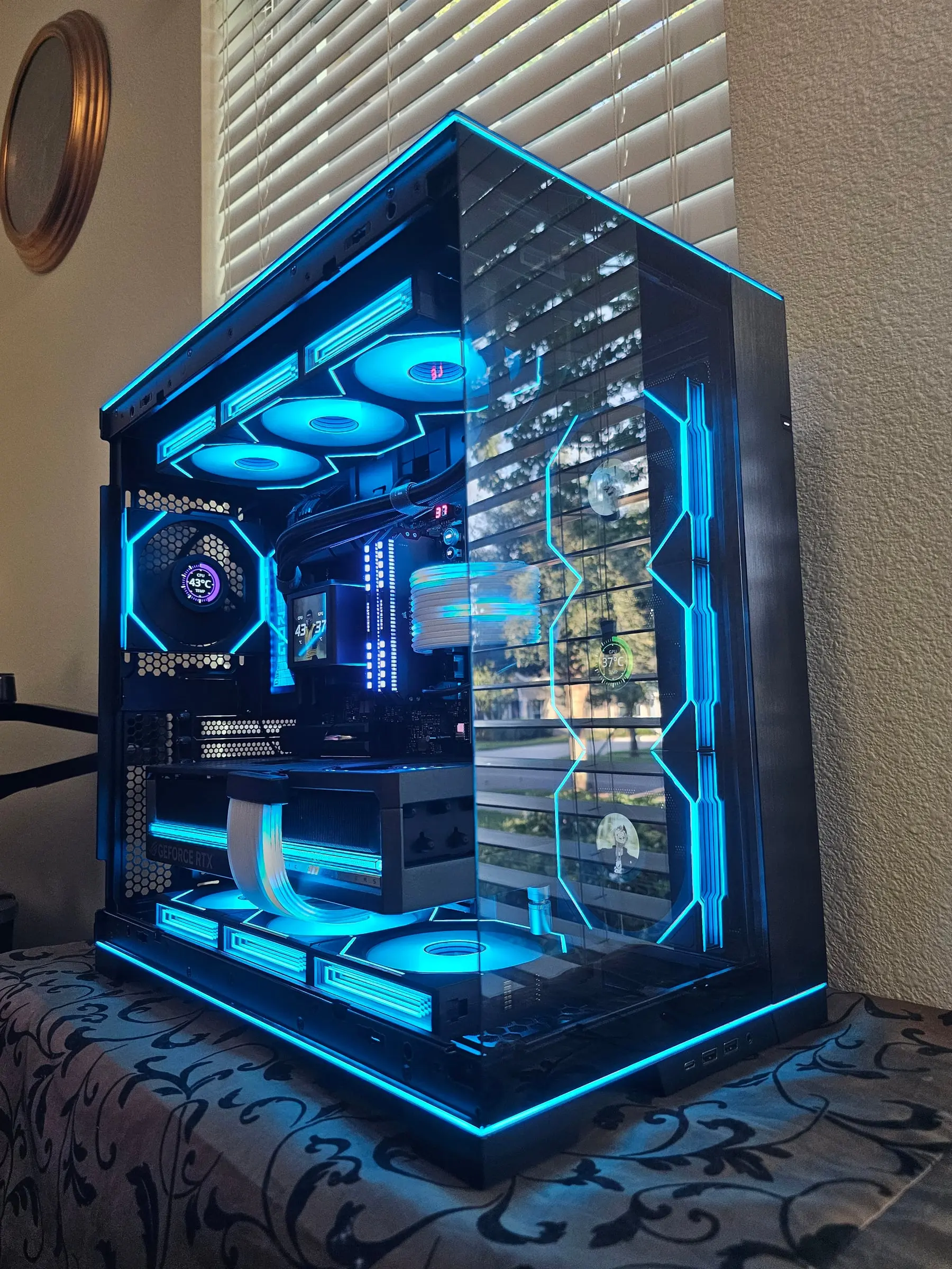Deep indigo theme with portrait art on the TL LCD fan screens