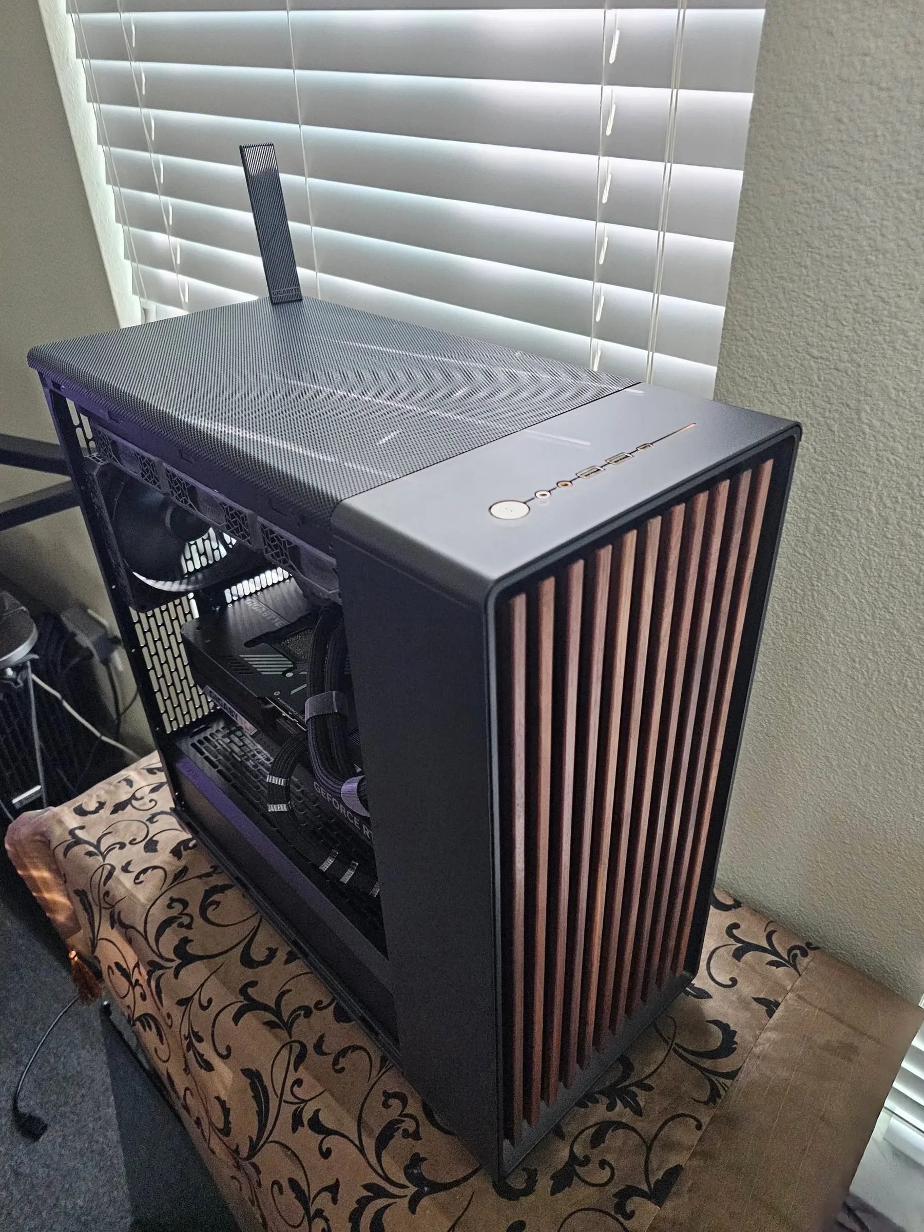 Side profile with sleeved cables feeding the GeForce RTX card behind the open panel