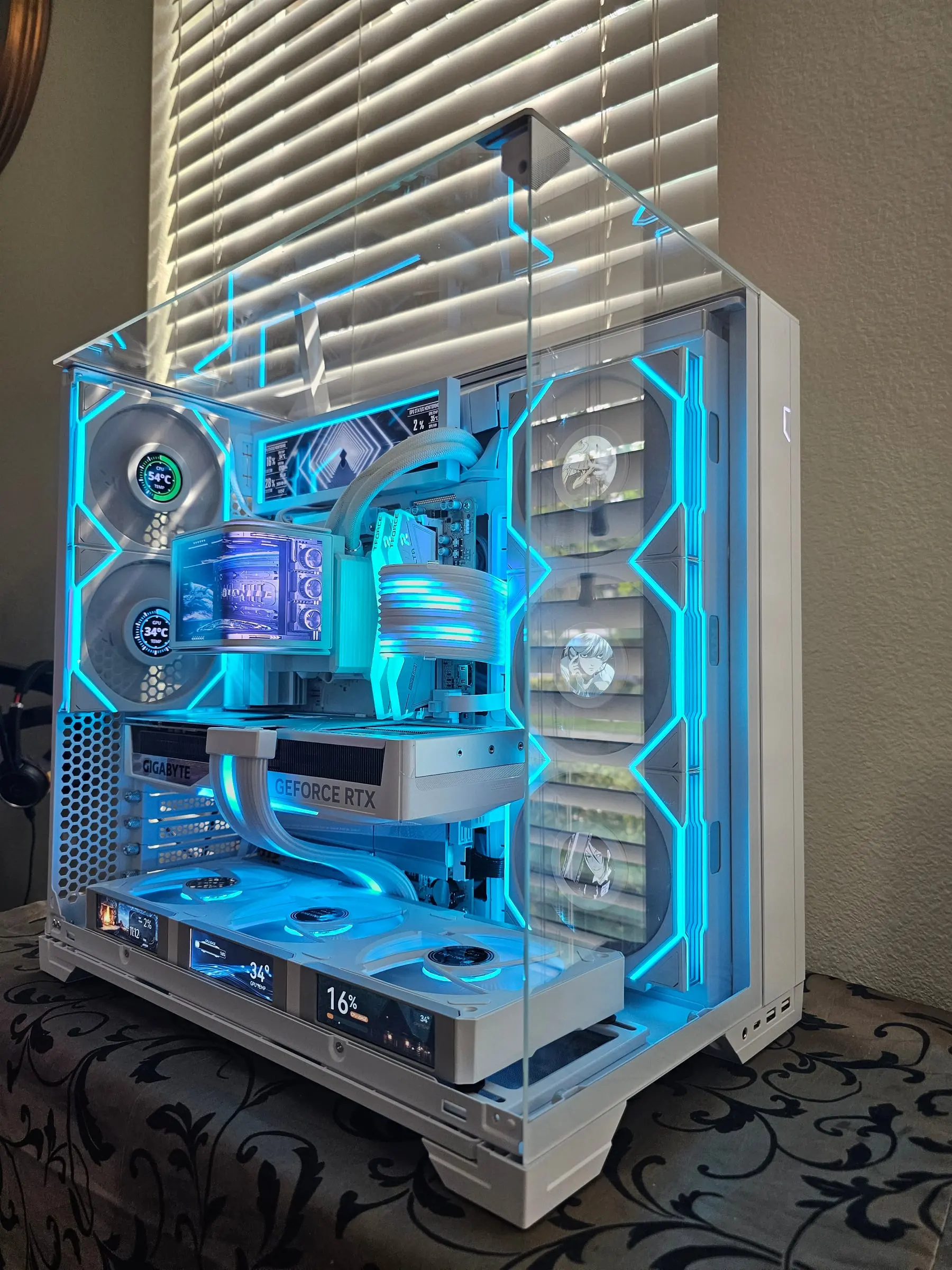 Aqua theme — the Hydroshift OLED mid-battle, JONSBO floor screens reading usage