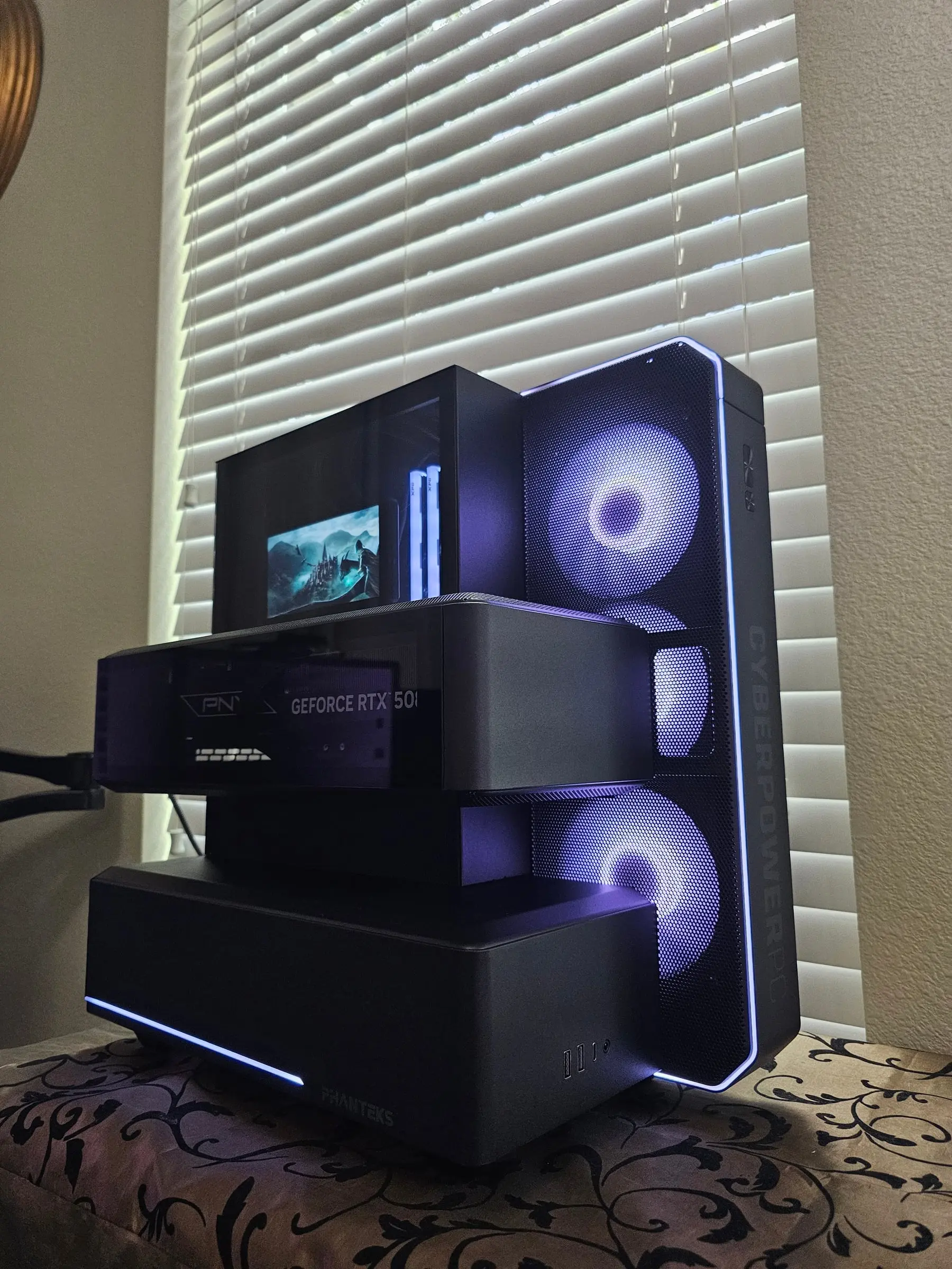 Violet-blue angle over the three modules with the LCD showing castle art