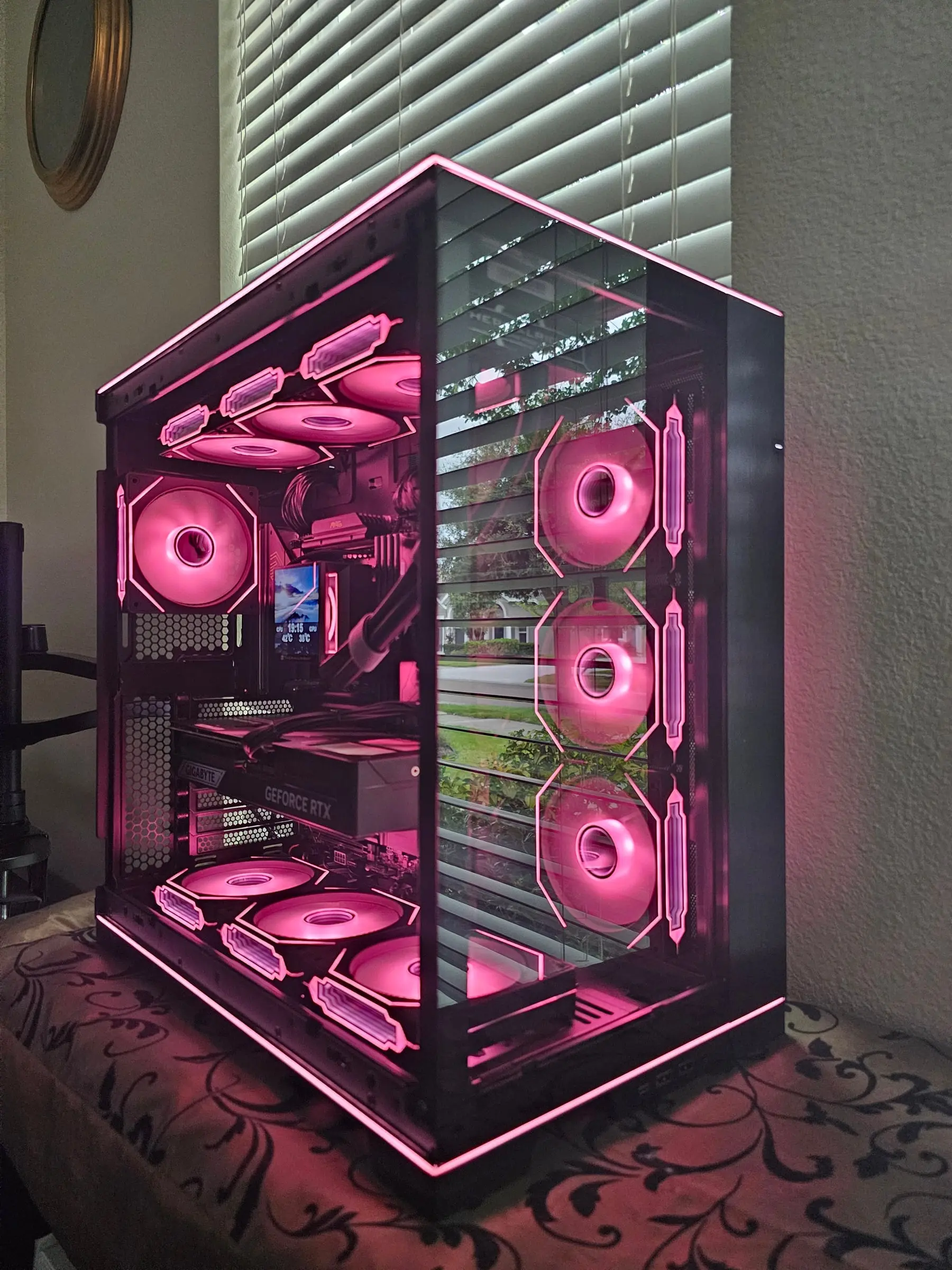 Hot pink theme — fans, edge strips, and reflections all matching