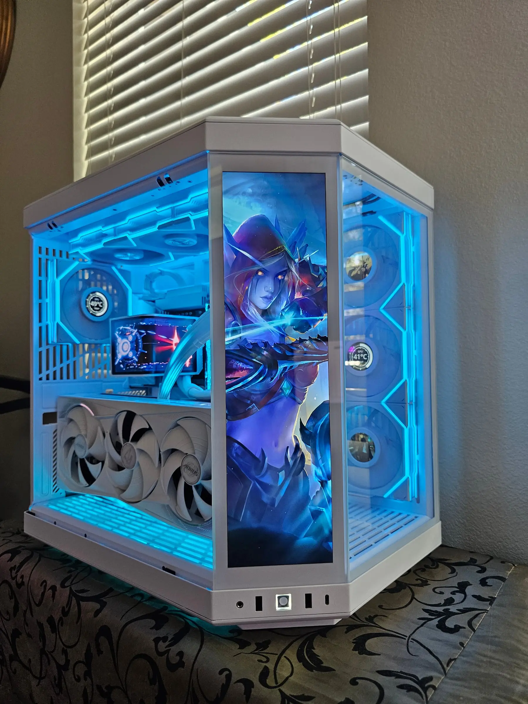 Deep blue theme with a World of Warcraft dark ranger illustration on the touchscreen