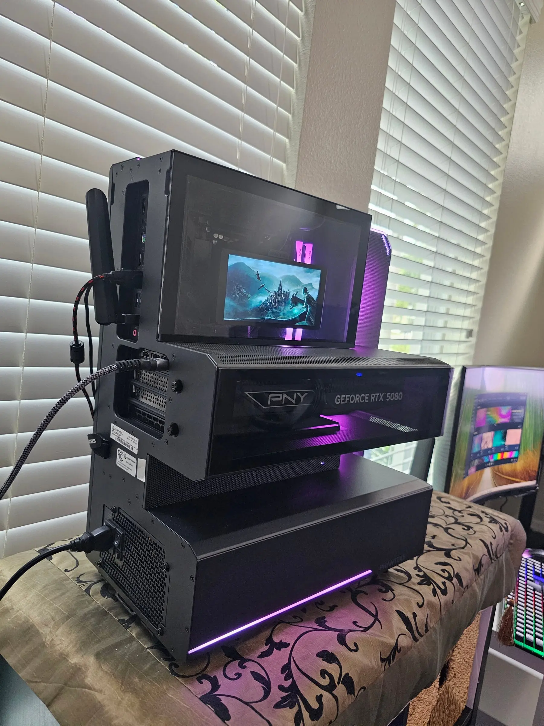 Rear view — Wi-Fi antenna, PSU switch on the plinth, and the 5080's back edge in its tray