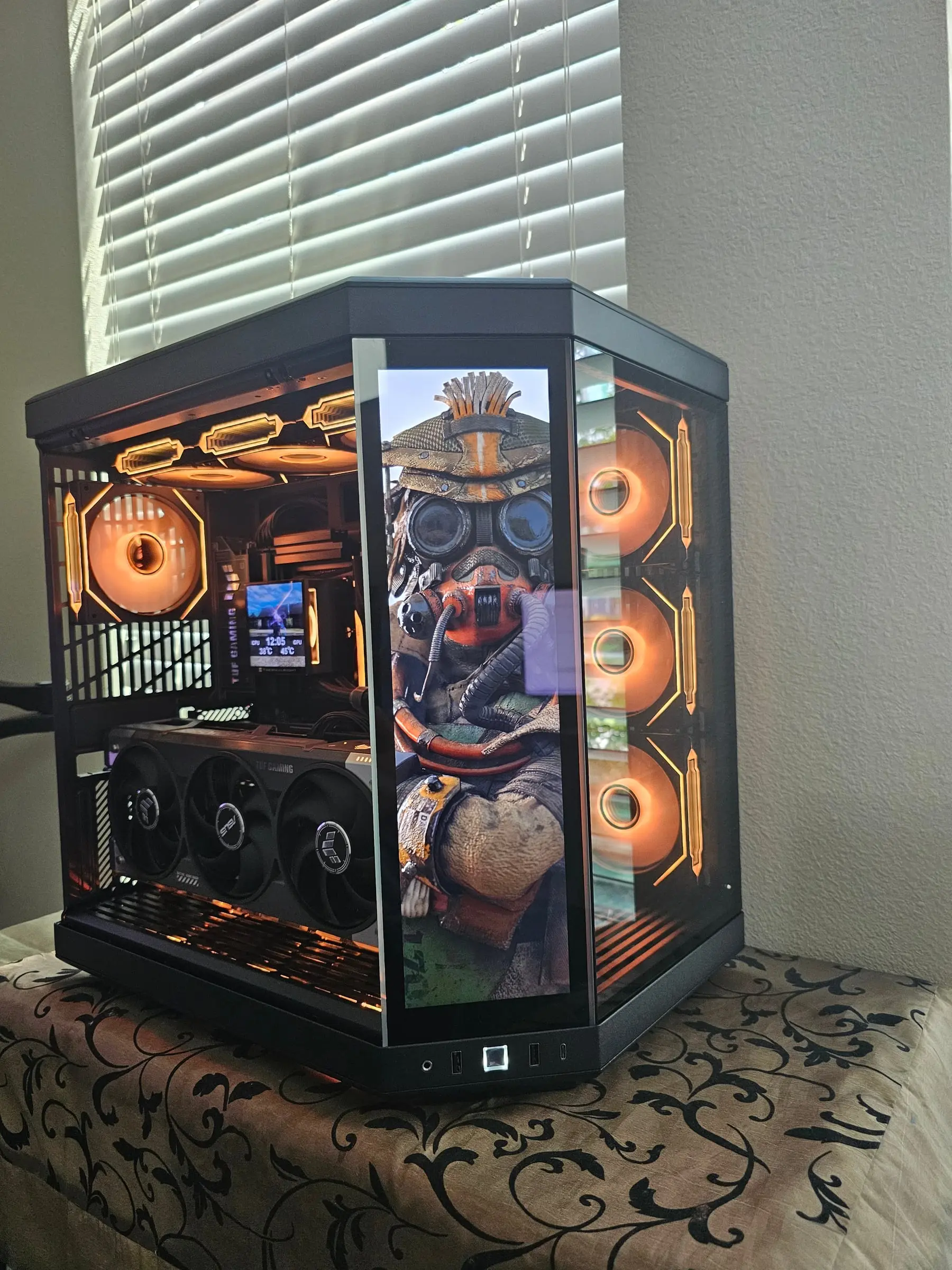Orange theme with Apex Legends Bloodhound art on the front touchscreen