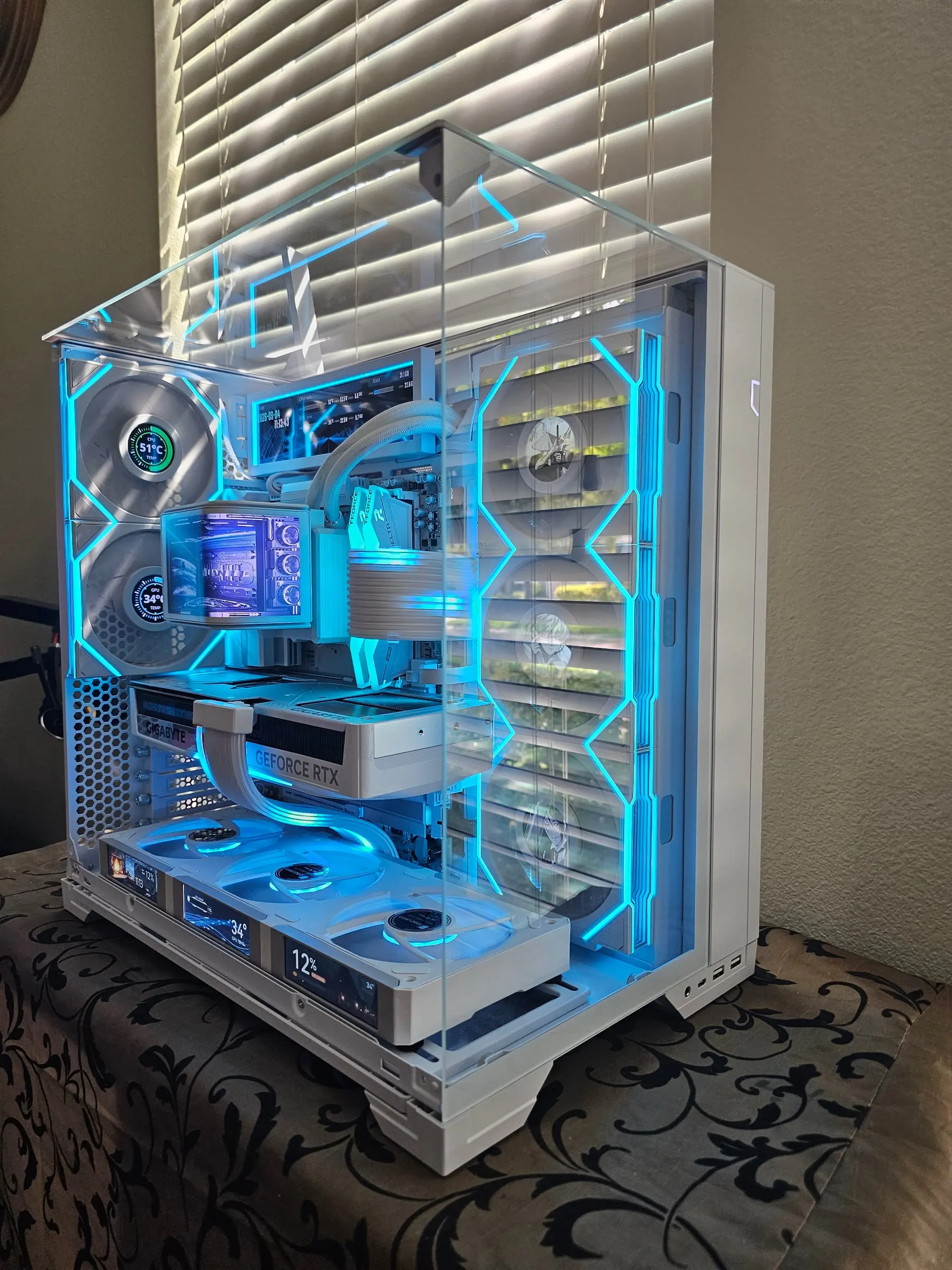 Cool blue side view — system dashboard on the 8.8-inch panel, Bleach art on the fan LCDs