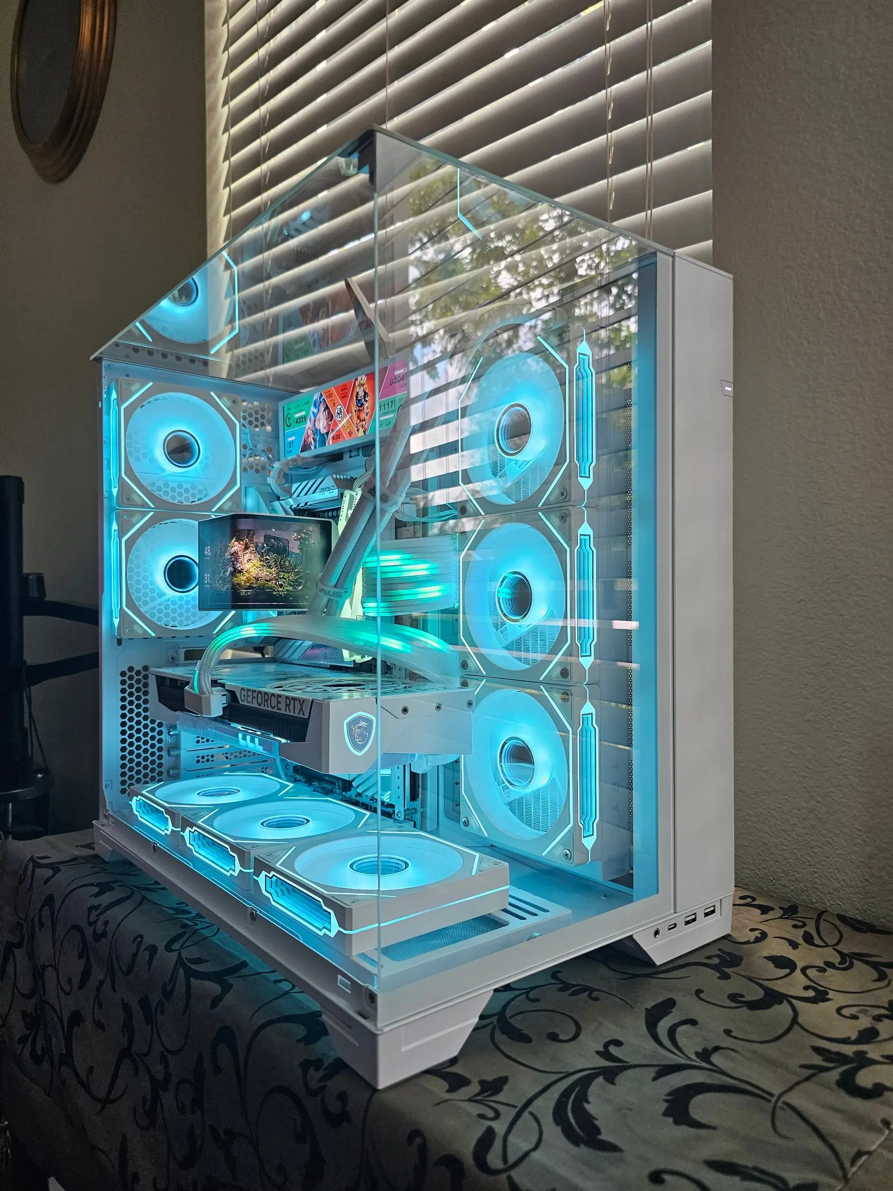 Cyan theme — Dragon Ball dashboard on the sensor panel, every fan ring lit ice blue