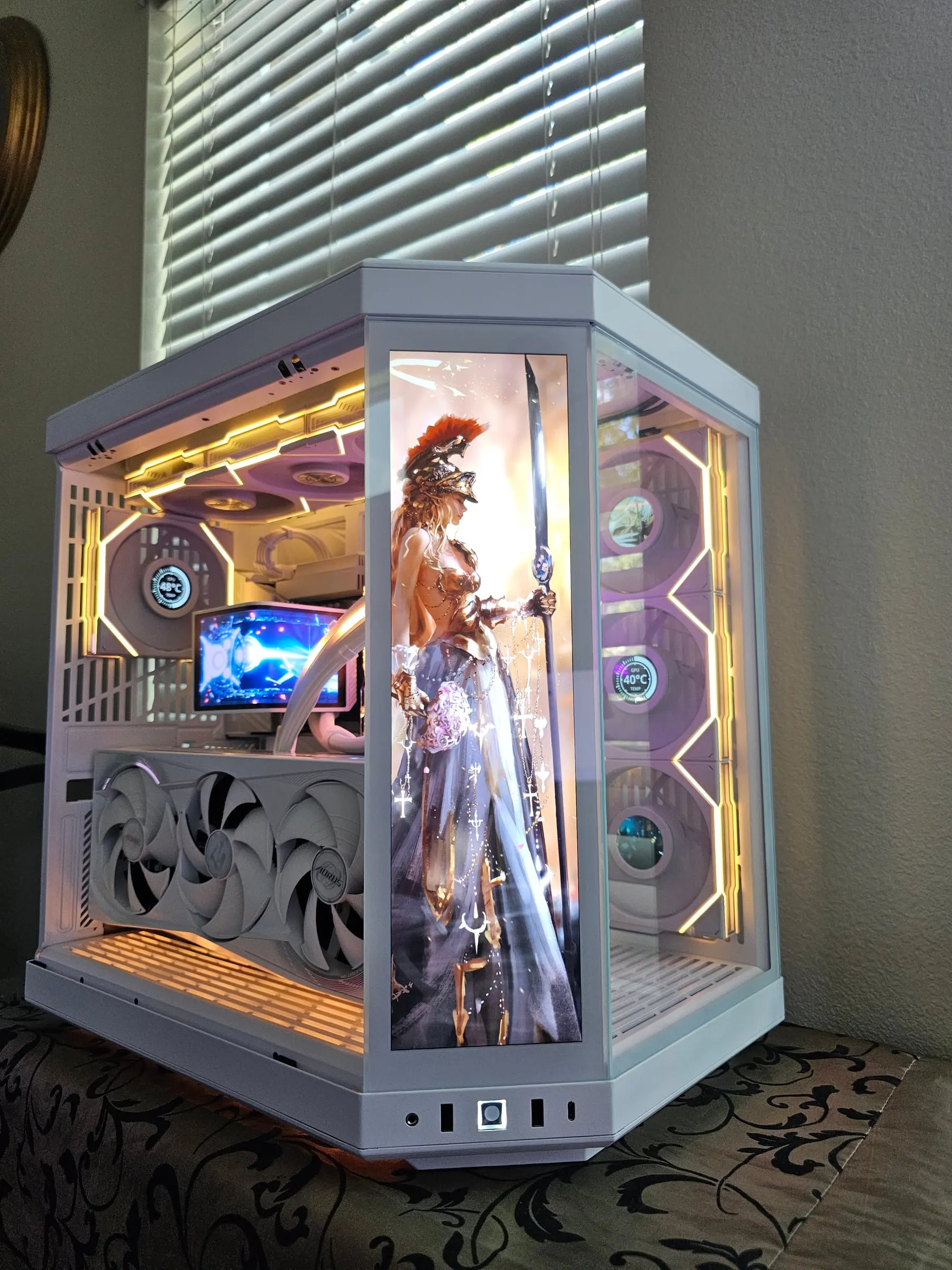 Warm gold lighting for the finale — a fantasy warrior goddess with a spear on the touchscreen, showcasing the full color range