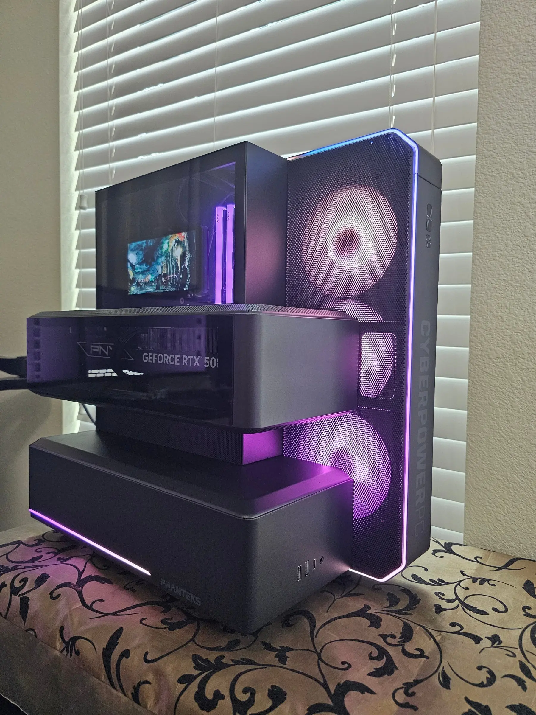 Violet-pink theme with the XPG Lancer Blade light bars glowing in the CPU cube
