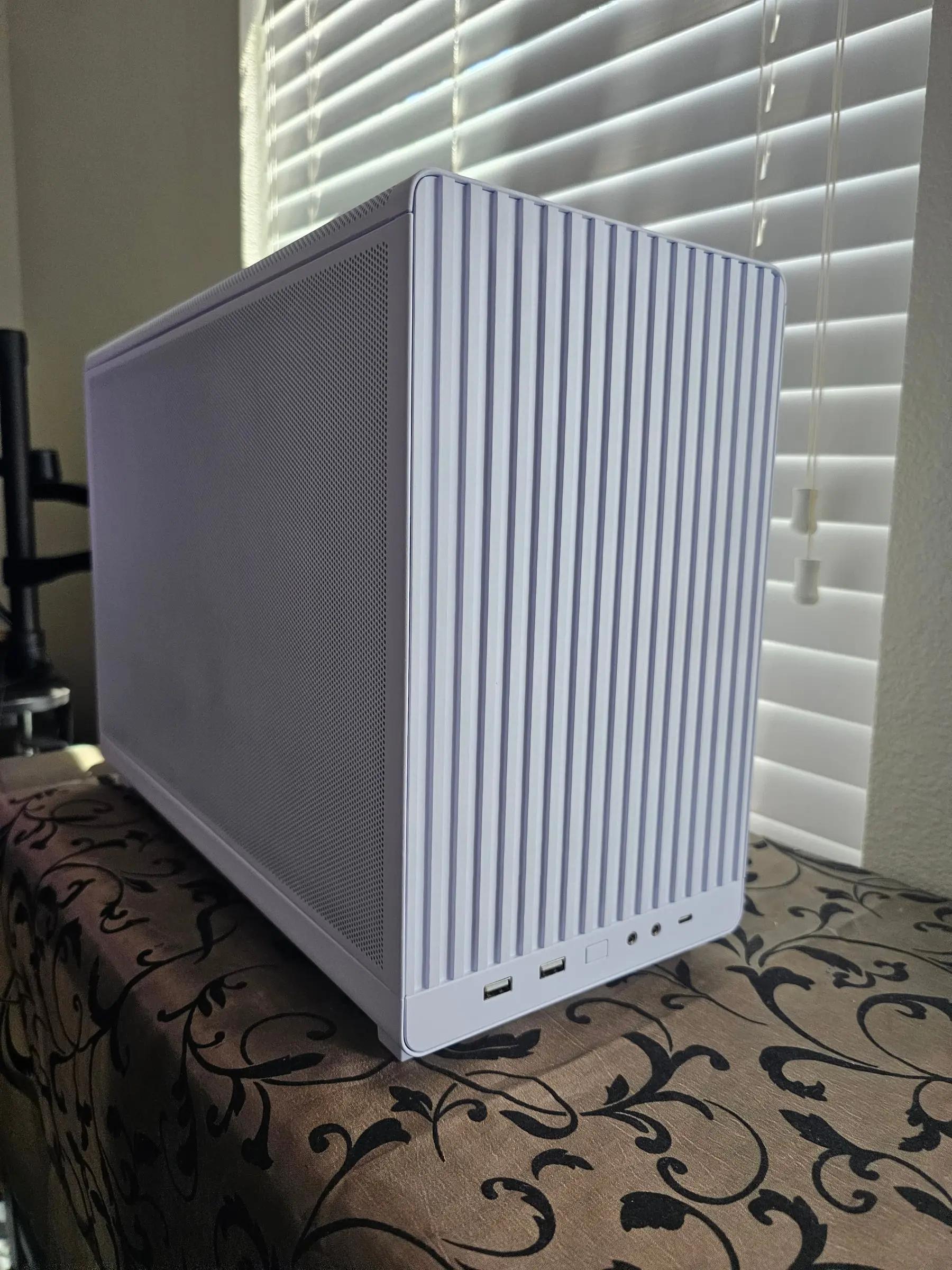 Side profile of the Lian Li A3 White showing the full-height mesh panel