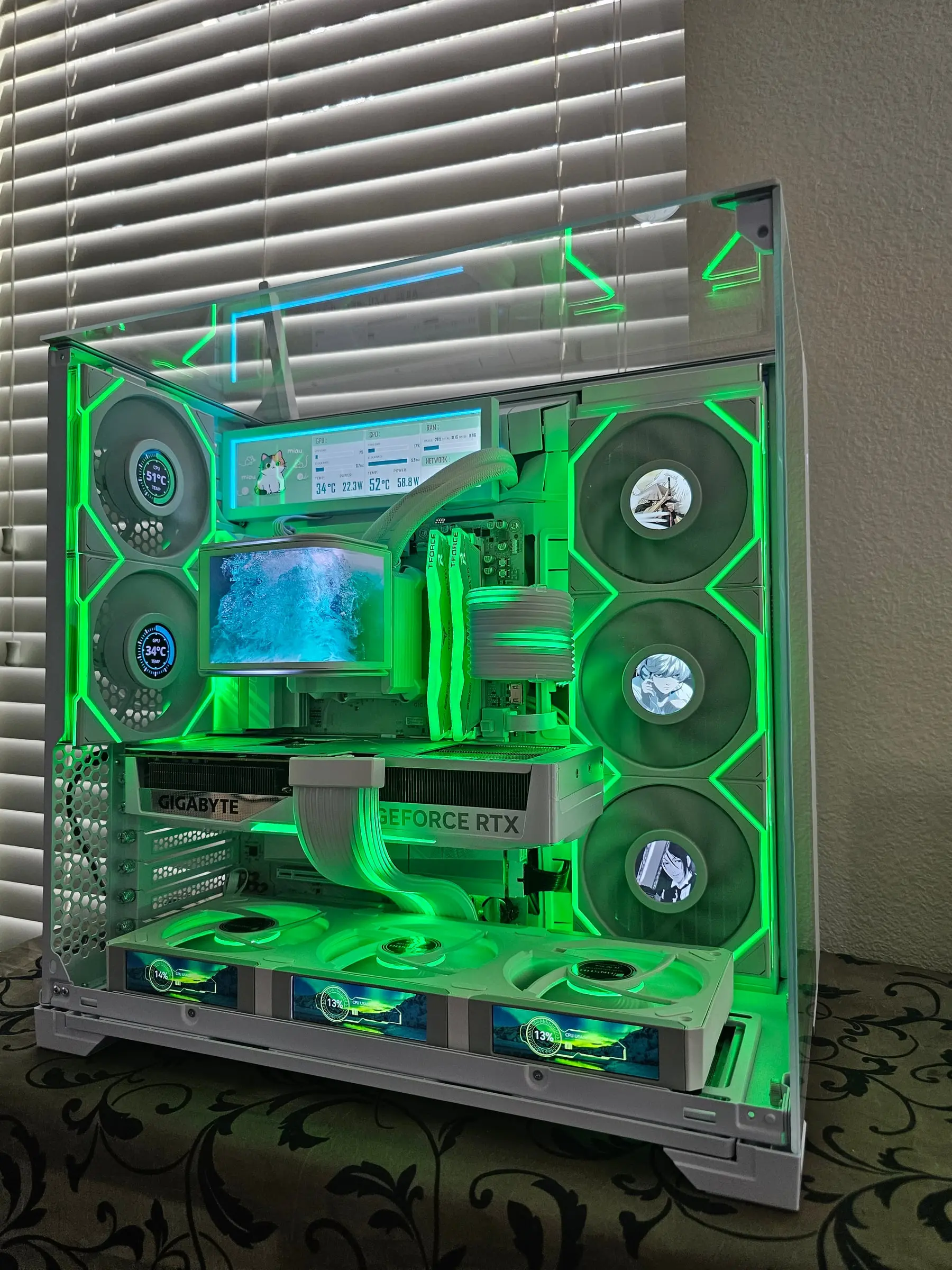 Green front-on — the cat dashboard reading power draw while the OLED shows crashing waves